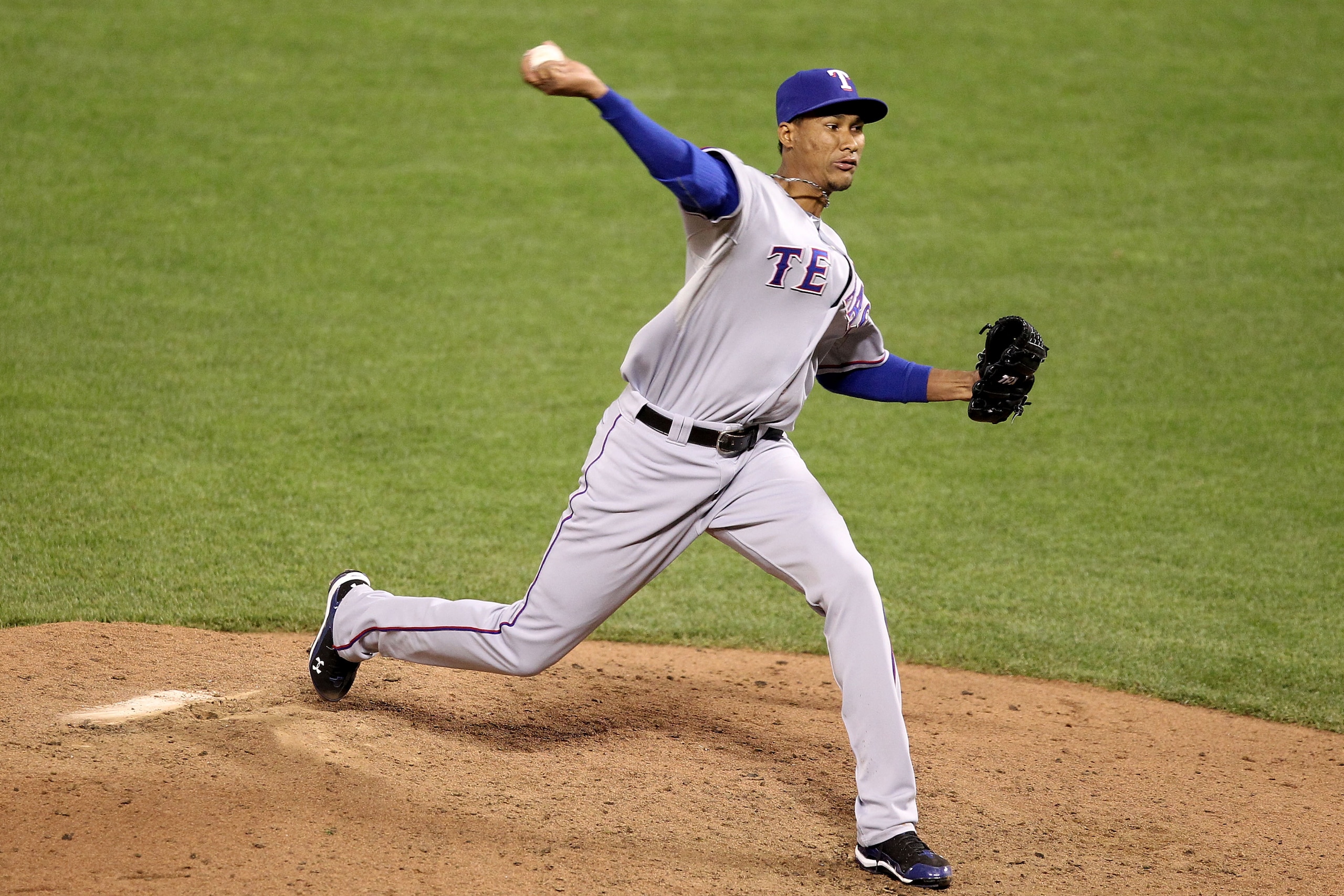 SAN FRANCISCO - OCTOBER 27:  Alexi Ogando #64 of the Texas Rangers pitches against the San Francisco Giants in Game One of the 2010 MLB World Series at AT&T Park on October 27, 2010 in San Francisco, California.  (Photo by Christian Petersen/Getty Images)