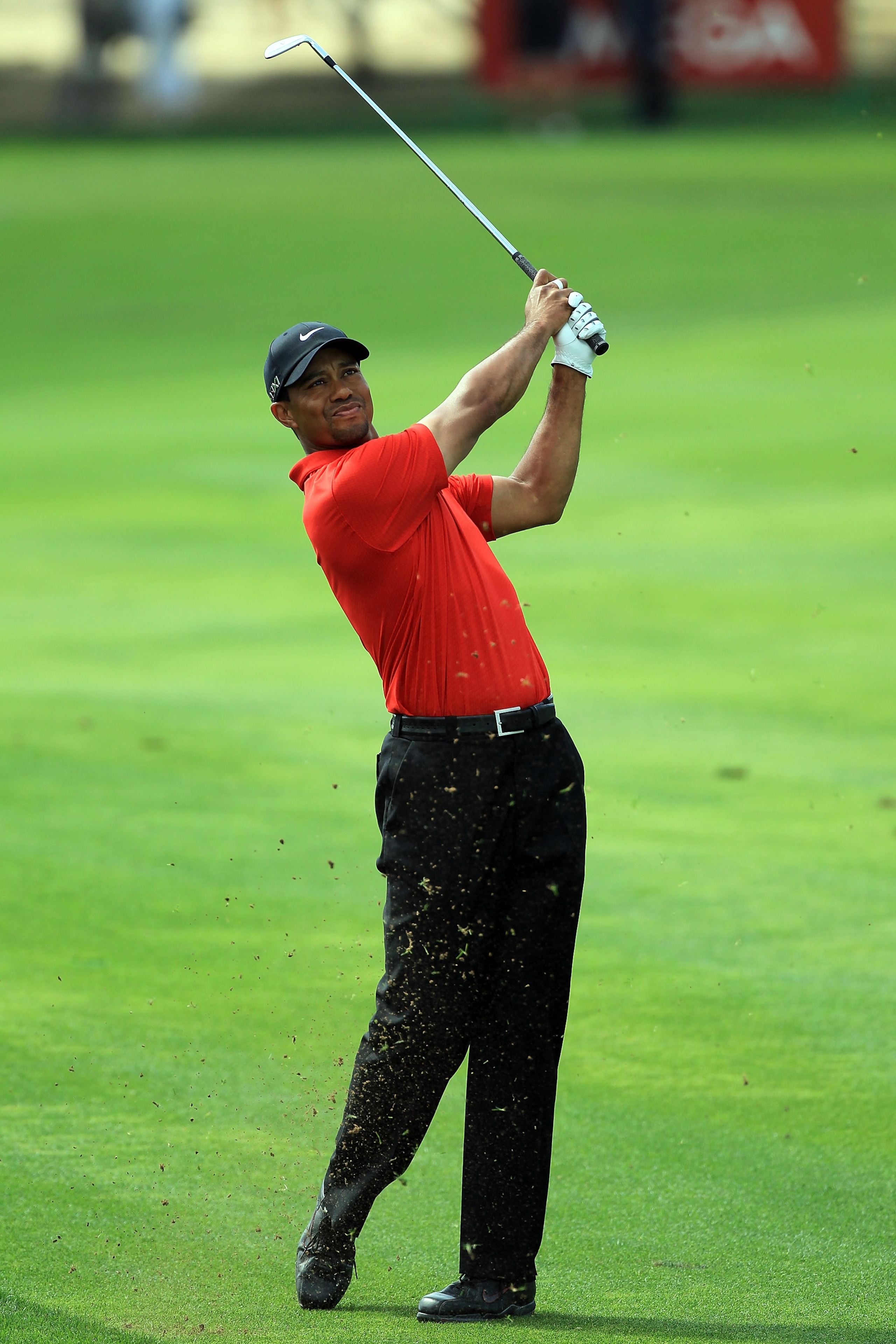 DUBAI, UNITED ARAB EMIRATES - FEBRUARY 13: Tiger Woods of the USA plays his second shot at the par 4, 1st hole during the final round of the 2011 Omega Dubai Desert Classic on the Majilis Course at the Emirates Golf Club on February 13, 2011 in Dubai, Un DUBAI, UNITED ARAB EMIRATES - FEBRUARY 13: Tiger Woods of the USA plays his second shot at the par 4, 1st hole during the final round of the 2011 Omega Dubai Desert Classic on the Majilis Course at the Emirates Golf Club on February 13, 2011 in Dubai, Un
