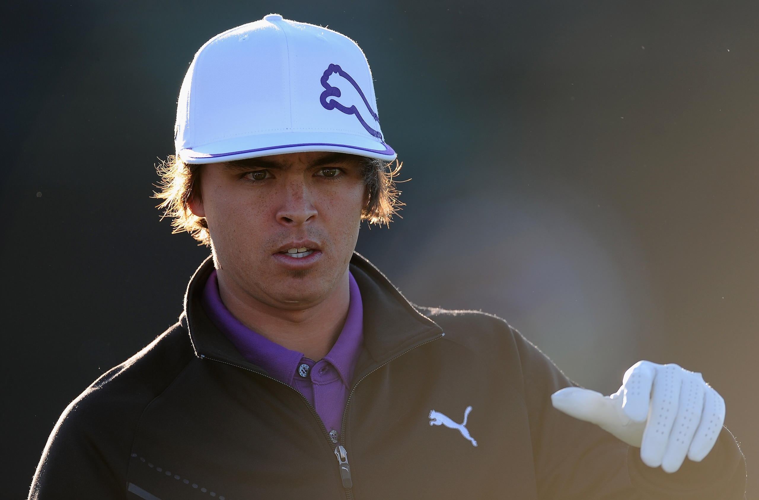 MARANA, AZ - FEBRUARY 22:  Rickie Fowler ponders during practice prior to the start of the World Golf Championships-Accenture Match Play Championship held at The Ritz-Carlton Golf Club, Dove Mountain on February 22, 2011 in Marana, Arizona.  (Photo by Stu