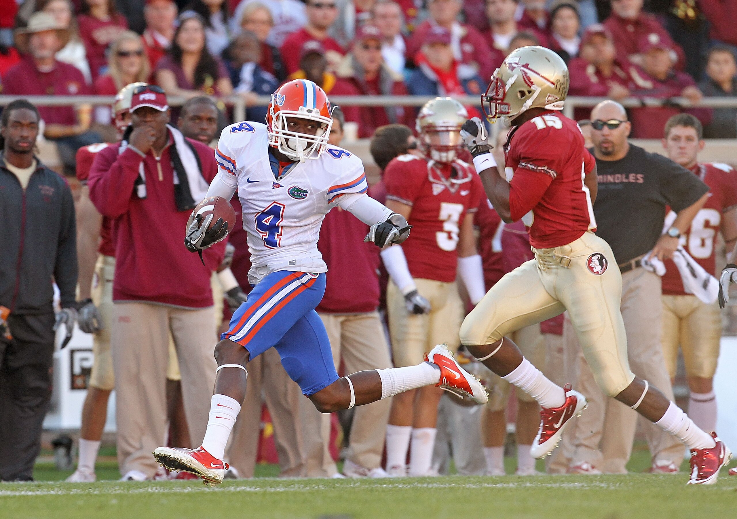 TALLAHASSEE, FL - NOVEMBER 27: Andre Debose #4 of the Florida Gators rushes after a catch before being forced out of bounds by Ochuko Jenije #15 of the Florida State Seminoles during a game at Doak Campbell Stadium on November 27, 2010 in Tallahassee, F TALLAHASSEE, FL - NOVEMBER 27: Andre Debose #4 of the Florida Gators rushes after a catch before being forced out of bounds by Ochuko Jenije #15 of the Florida State Seminoles during a game at Doak Campbell Stadium on November 27, 2010 in Tallahassee, F