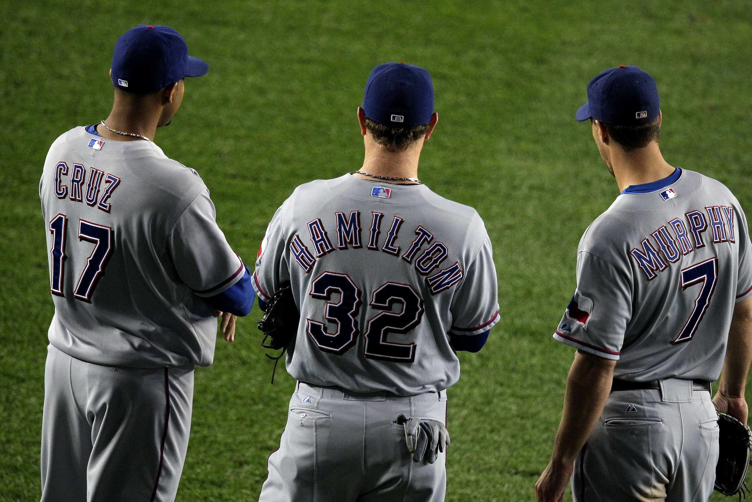 NEW YORK - OCTOBER 19:  Nelson Cruz #17, Josh Hamilton #32 and David Murphy #7 of the Texas Rangers look on against the New York Yankees in Game Four of the ALCS during the 2010 MLB Playoffs at Yankee Stadium on October 19, 2010 in the Bronx borough of Ne