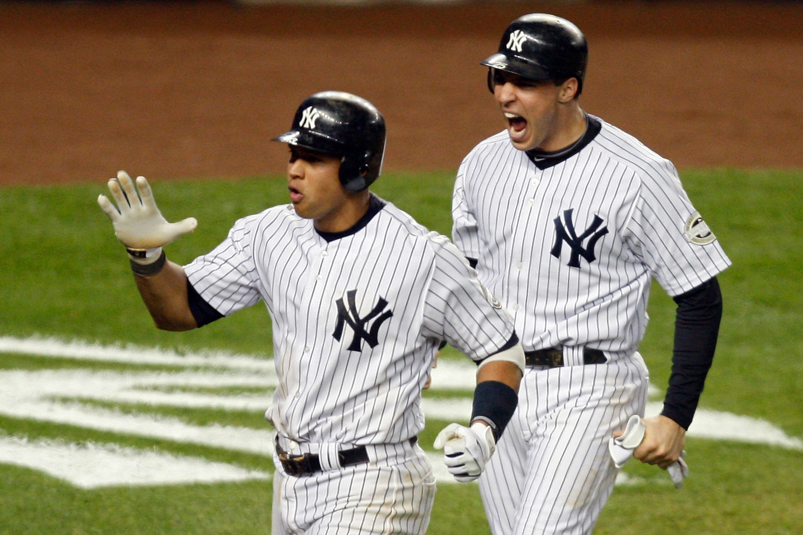 NEW YORK - NOVEMBER 04:   Mark Teixeira #25 and Alex Rodriguez #13 (L) of the New York Yankees celebrate after they scored on a 2-run double by Hideki Matsui #55 in the bottom of the fifth inning against the Philadelphia Phillies in Game Six of the 2009 M