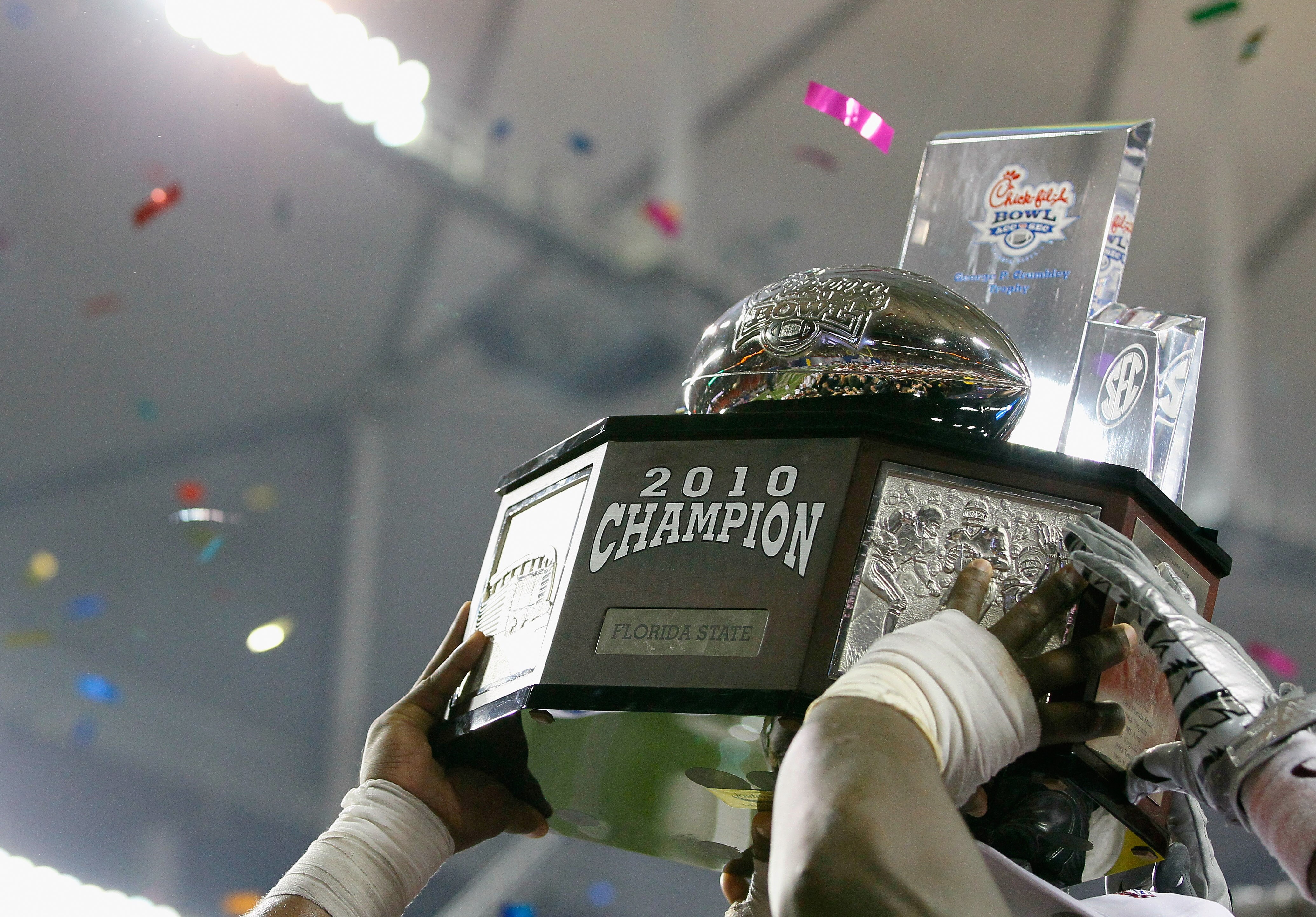 ATLANTA, GA - DECEMBER 31:  The Florida State Seminoles hold up the trophy after their 26-17 win over the South Carolina Gamecocks during the 2010 Chick-fil-A Bowl at Georgia Dome on December 31, 2010 in Atlanta, Georgia.  (Photo by Kevin C. Cox/Getty Ima