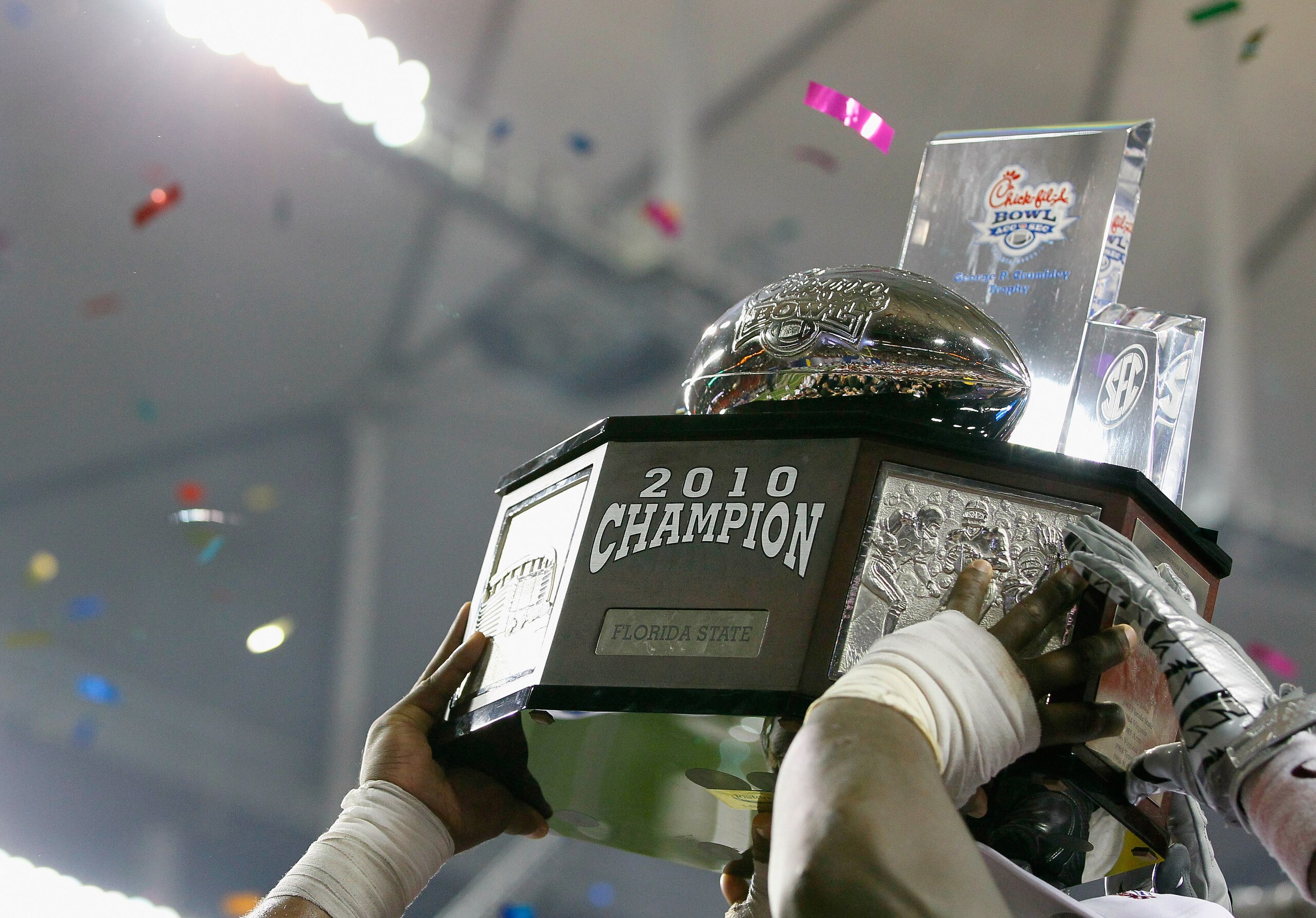 ATLANTA, GA - DECEMBER 31: The Florida State Seminoles hold up the trophy after their 26-17 win over the South Carolina Gamecocks during the 2010 Chick-fil-A Bowl at Georgia Dome on December 31, 2010 in Atlanta, Georgia. (Photo by Kevin C. Cox/Getty Ima ATLANTA, GA - DECEMBER 31: The Florida State Seminoles hold up the trophy after their 26-17 win over the South Carolina Gamecocks during the 2010 Chick-fil-A Bowl at Georgia Dome on December 31, 2010 in Atlanta, Georgia. (Photo by Kevin C. Cox/Getty Ima
