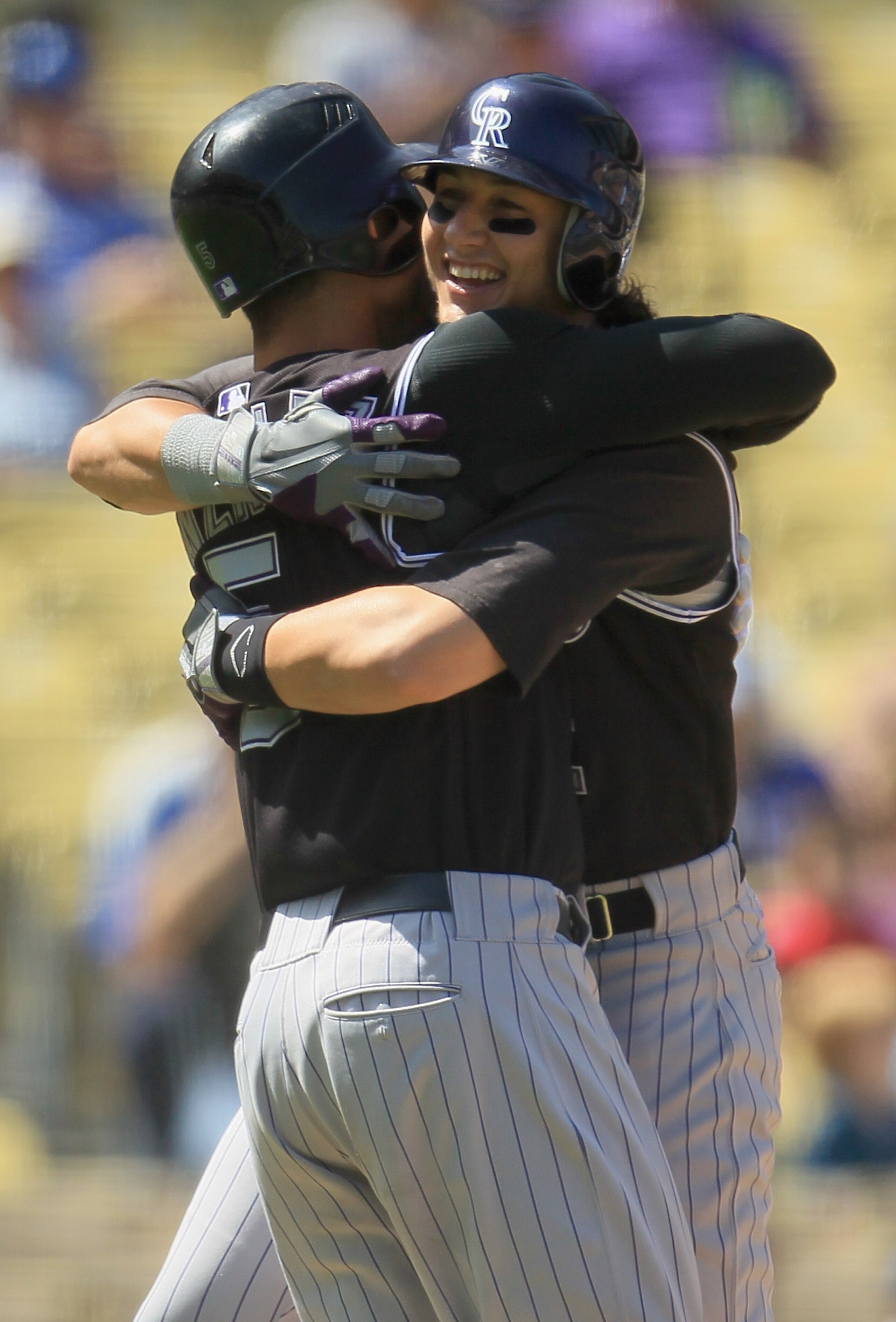 LOS ANGELES, CA - SEPTEMBER 18:  Troy Tulowitzki(R) #2 of the Colorado Rockies is congratulated by teammate Carlos Gonzalez (L) #5 after hitting a two-run home run against the Los Angeles Dodgers in the first inning at Dodger Stadium on September 18, 2010