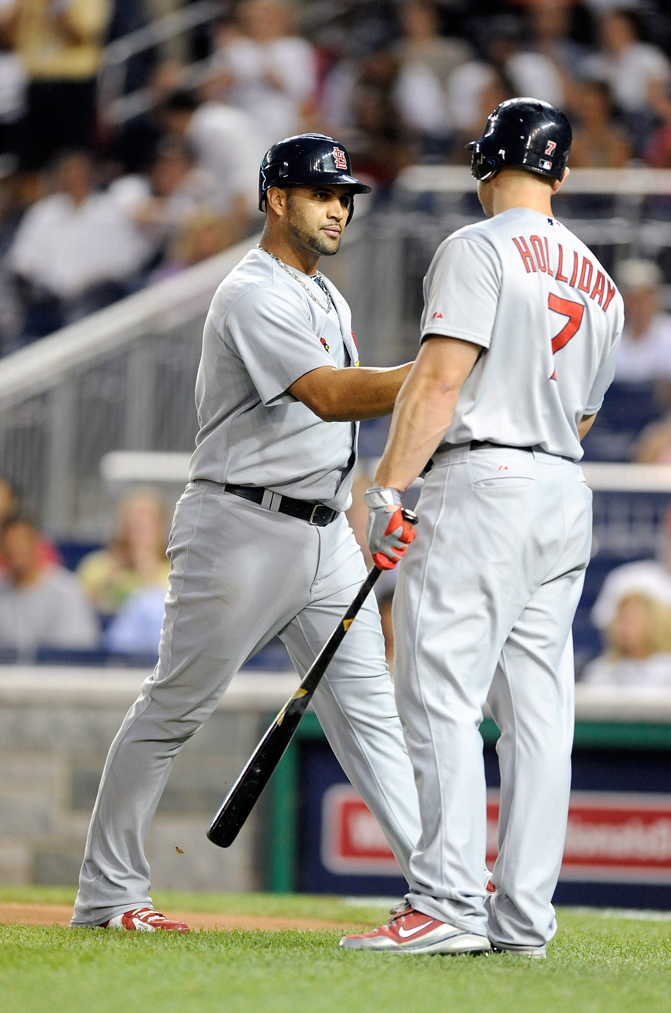 WASHINGTON - AUGUST 26:  Albert Pujols #5 of the St. Louis Cardinals is congratulated by Matt Holliday #7 after hitting a home run in the fourth inning against the Washington Nationals at Nationals Park on August 26, 2010 in Washington, DC. It was the 400