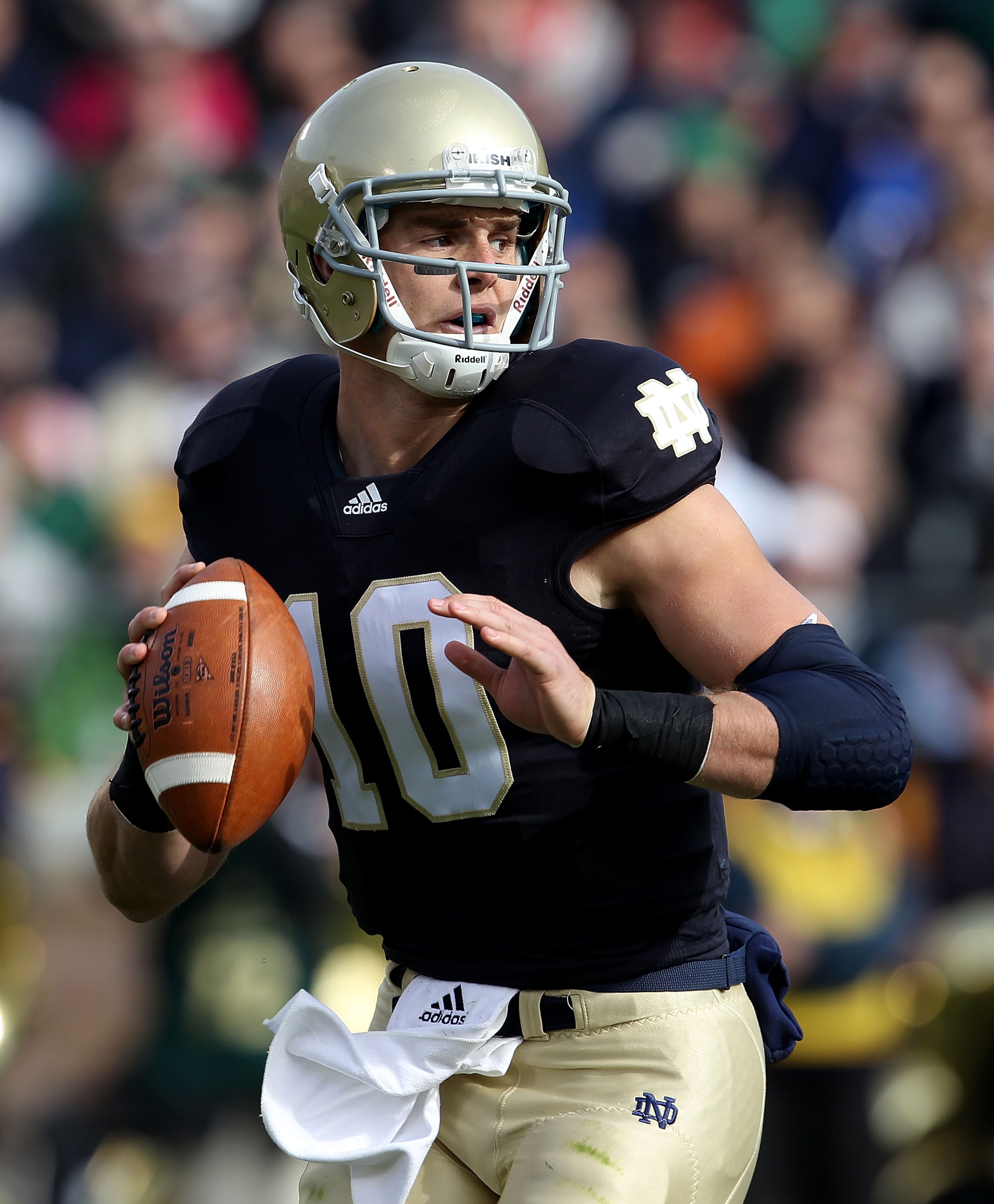 SOUTH BEND, IN - OCTOBER 30: Dayne Crist #10 of the Notre Dame Fighting Irish looks for a receiver against the Tulsa Golden Hurricane at Notre Dame Stadium on October 30, 2010 in South Bend, Indiana. Tulsa defeated Notre Dame 28-27. (Photo by Jonathan Dan