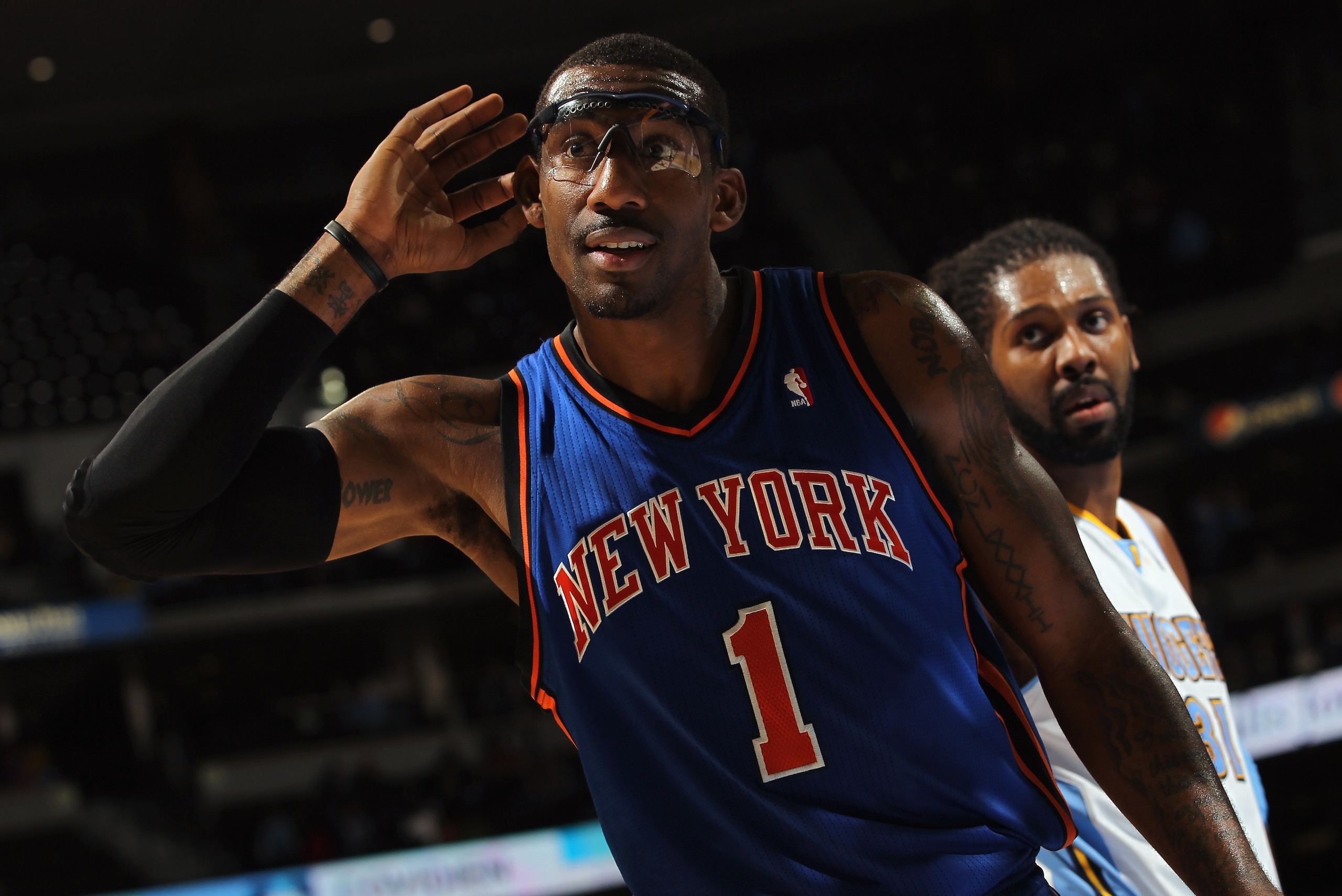 DENVER - NOVEMBER 16:  Amar'e Stoudemire #1 of the New York Knicks holds his hand to his ear as he attempts to engage the home team fans of the Denver Nuggets at the Pepsi Center on November 16, 2010 in Denver, Colorado. NOTE TO USER: User expressly ackno