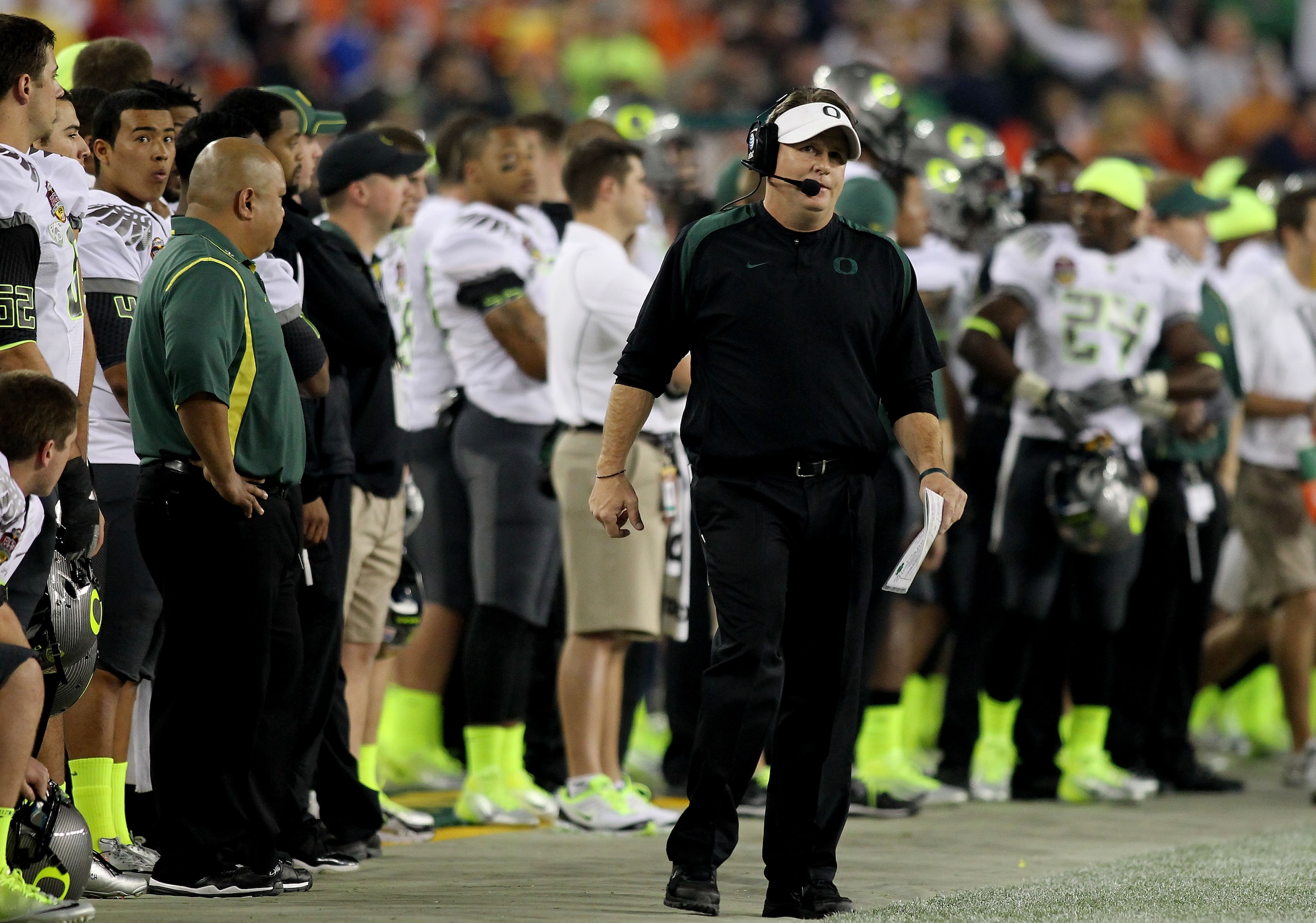 GLENDALE, AZ - JANUARY 10:  Head coach Chip Kelly of the Oregon Ducks looks on from the bench against the Auburn Tigers in the Tostitos BCS National Championship Game at University of Phoenix Stadium on January 10, 2011 in Glendale, Arizona.  (Photo by Jo