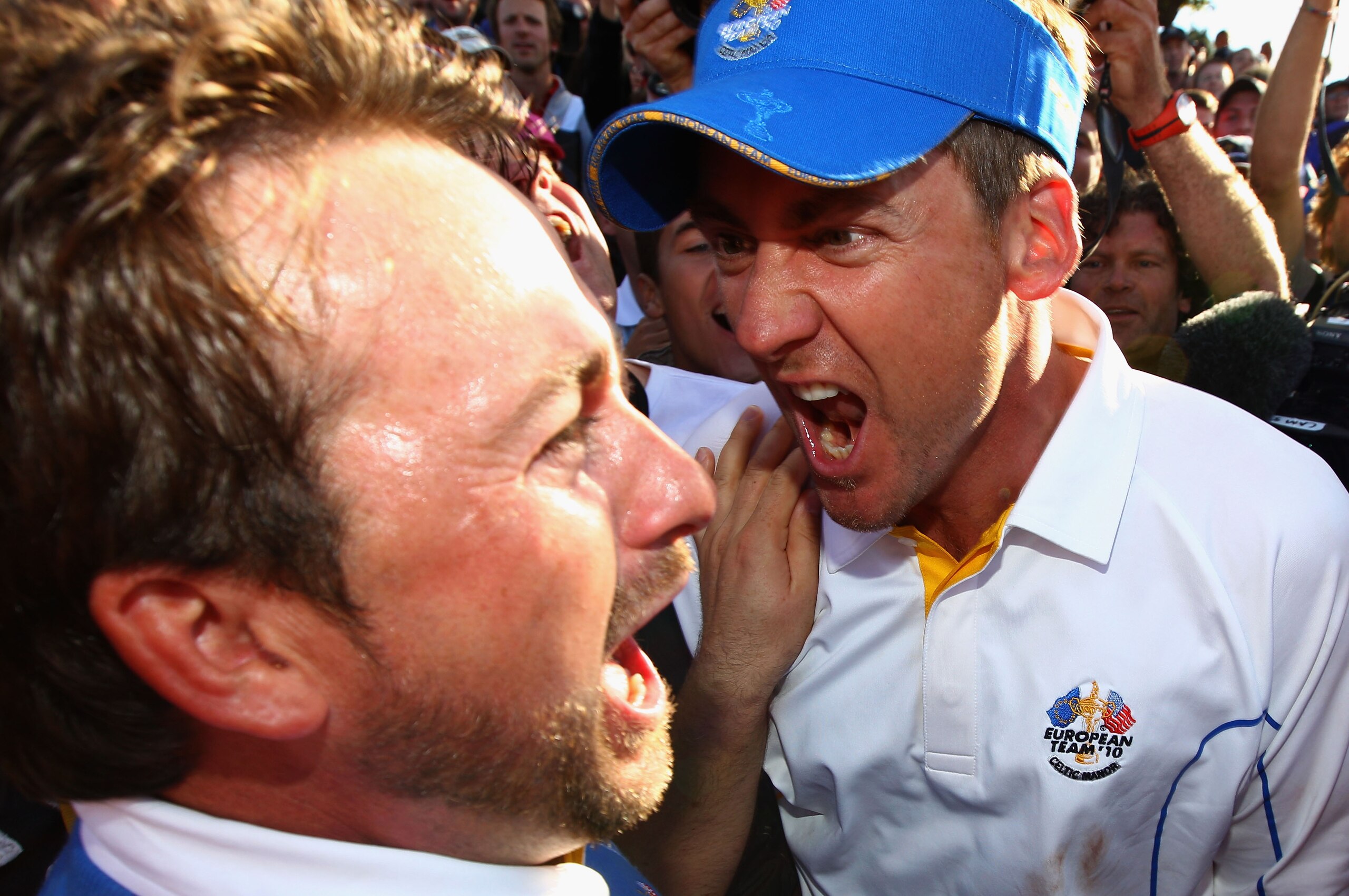NEWPORT, WALES - OCTOBER 04:  Graeme McDowell of Europe celebrates his 3&1 win to secure victory for  the European team on the 17th green with Ian Poulter (R) in the singles matches during the 2010 Ryder Cup at the Celtic Manor Resort on October 4, 2010 i