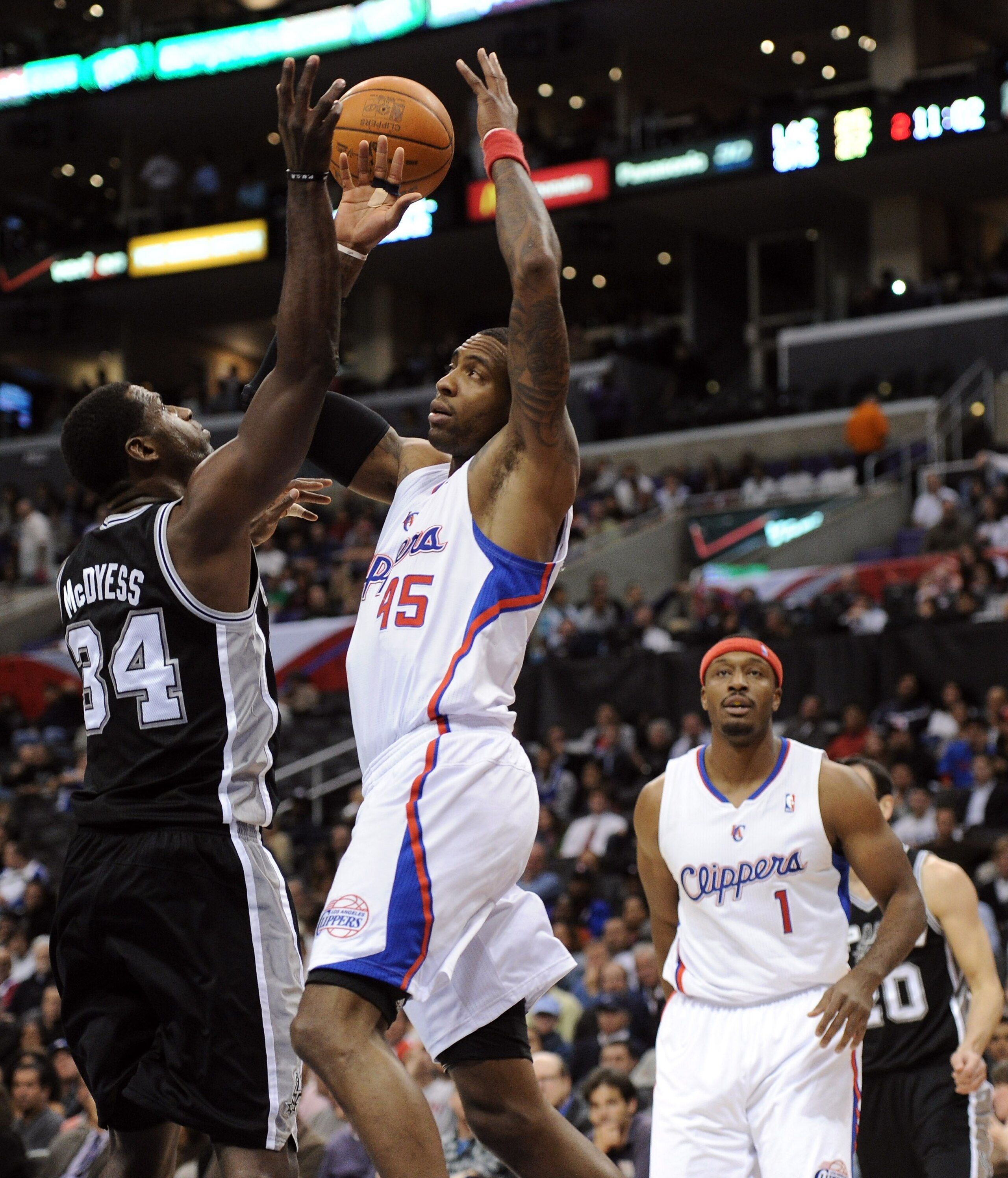 LOS ANGELES, CA - DECEMBER 01:  Rasual Butler #45 of the Los Angeles Clippers goes after a rebound with Antonio McDyess #34 of the San Antonio Spurs at the Staples Center on December 1, 2010 in Los Angeles, California.  NOTE TO USER: User expressly acknow