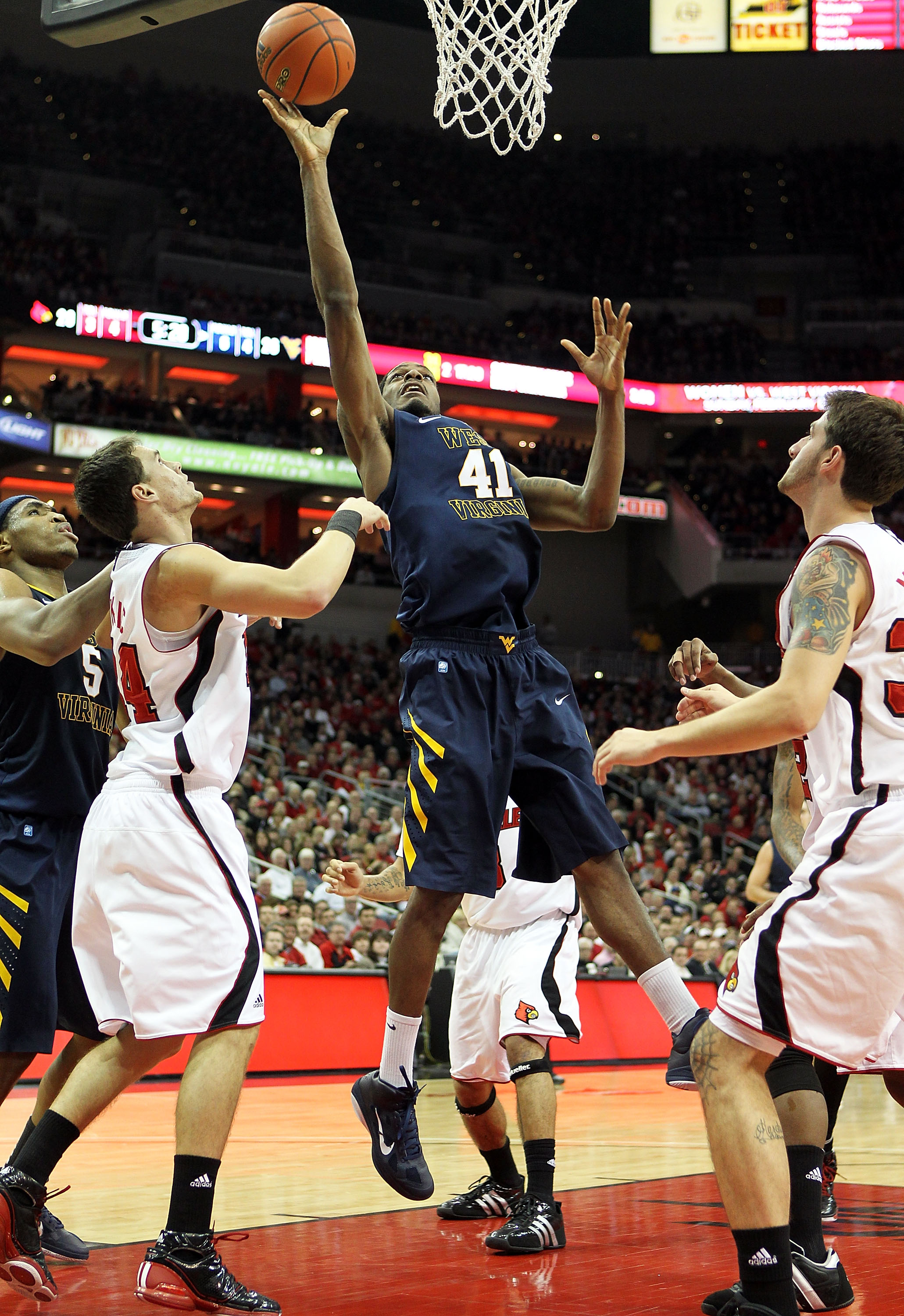 LOUISVILLE, KY - JANUARY 26: John Flowers #41 of the West Virginia Mountaineers shoots the ball during the Big East Conference game against the Louisville Cardinals at the KFC Yum! Center on January 26, 2011 in Louisville, Kentucky. Louisville won 55-54