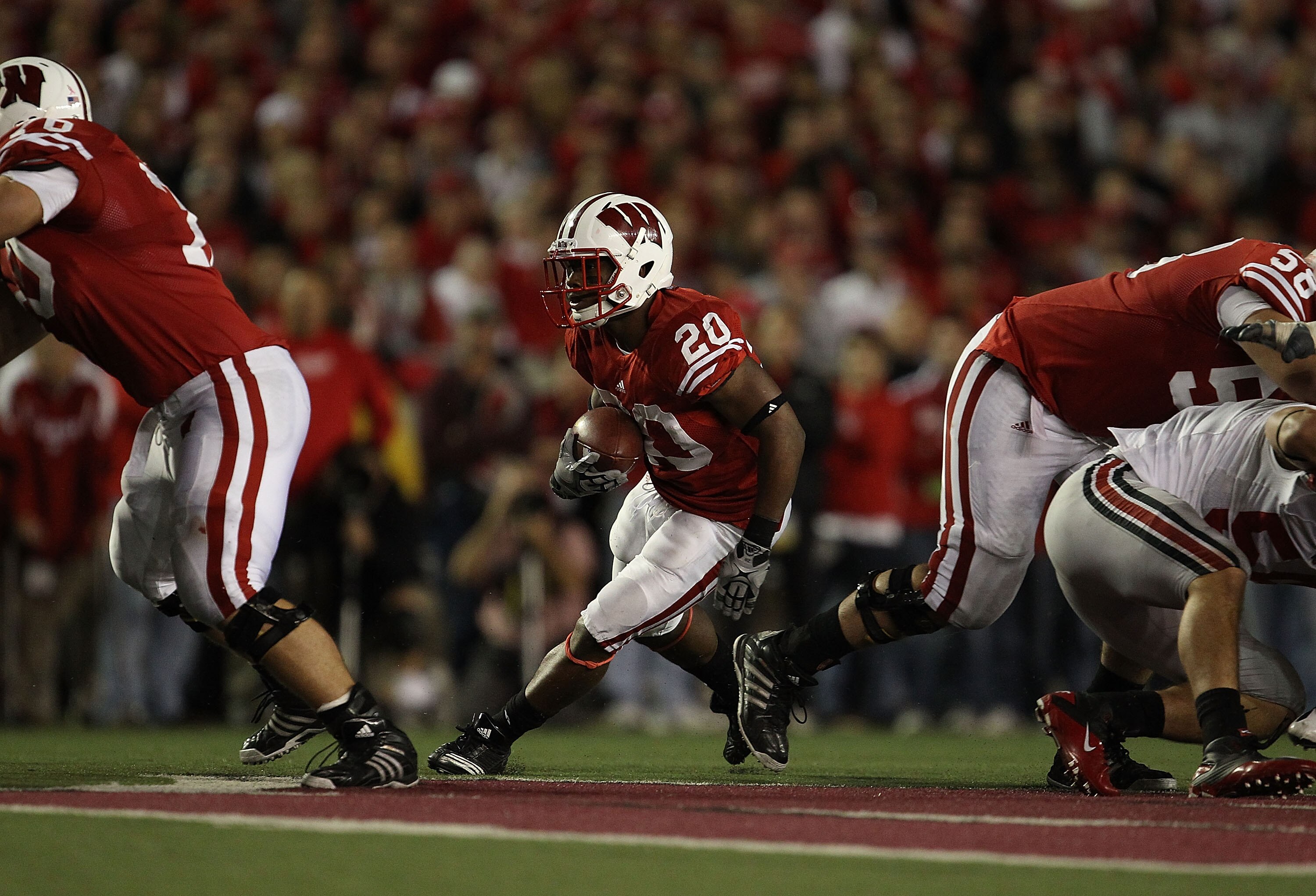 MADISON, WI - OCTOBER 16: James White #20 of the Wisconsin Badgers runs against the Ohio State Buckeyes at Camp Randall Stadium on October 16, 2010 in Madison, Wisconsin. Wisconsin defeated Ohio State 31-18. (Photo by Jonathan Daniel/Getty Images)