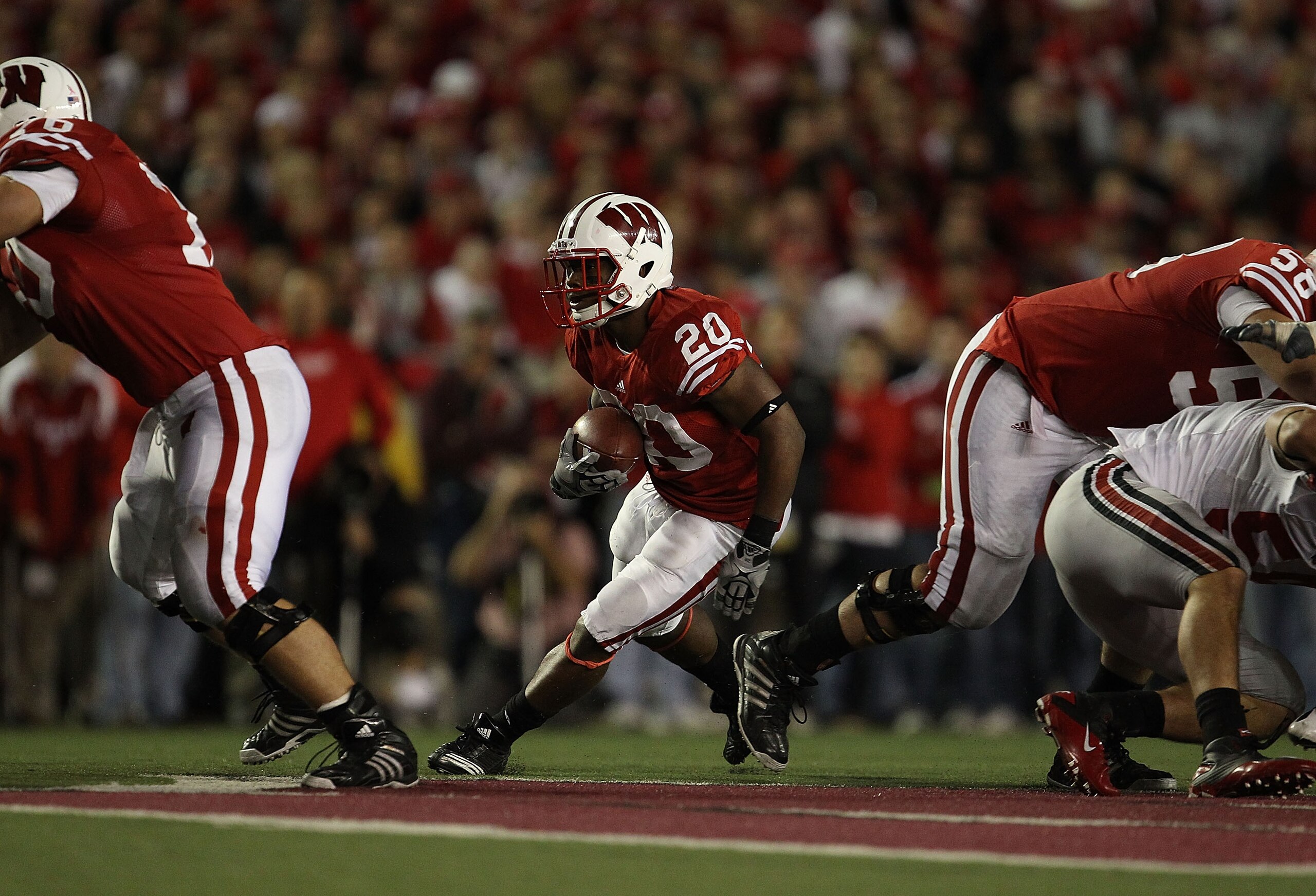MADISON, WI - OCTOBER 16: James White #20 of the Wisconsin Badgers runs against the Ohio State Buckeyes at Camp Randall Stadium on October 16, 2010 in Madison, Wisconsin. Wisconsin defeated Ohio State 31-18. (Photo by Jonathan Daniel/Getty Images)
