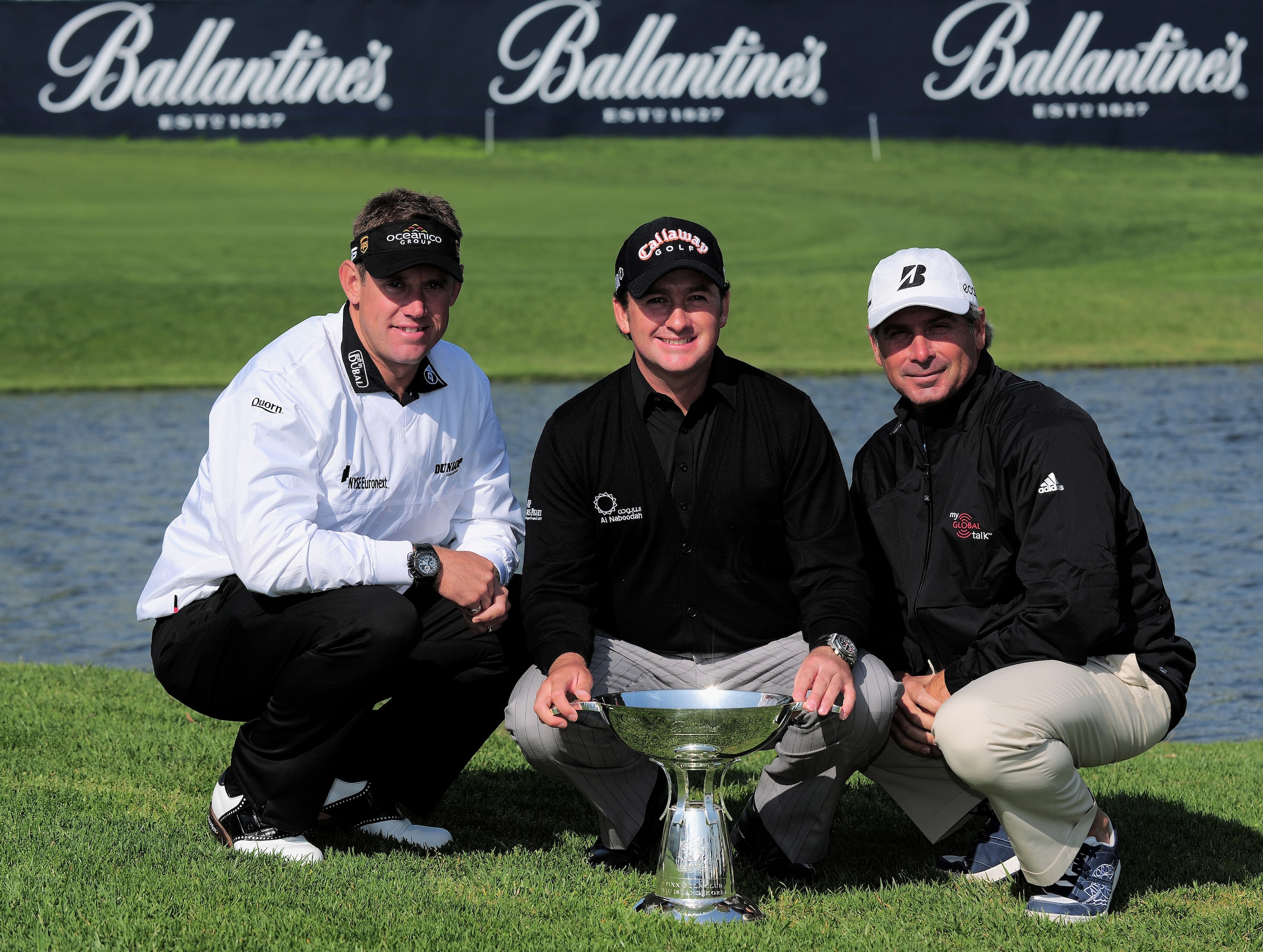 JEJU, SOUTH KOREA - APRIL 21:  Lee Westwood of England, Graeme McDowell of Northern Ireland and Fred Couples of USA and Lee Westwood of England pose for a picture prior to the start of the Ballantine's Championship at Pinx Golf Club on April 21, 2009 on J