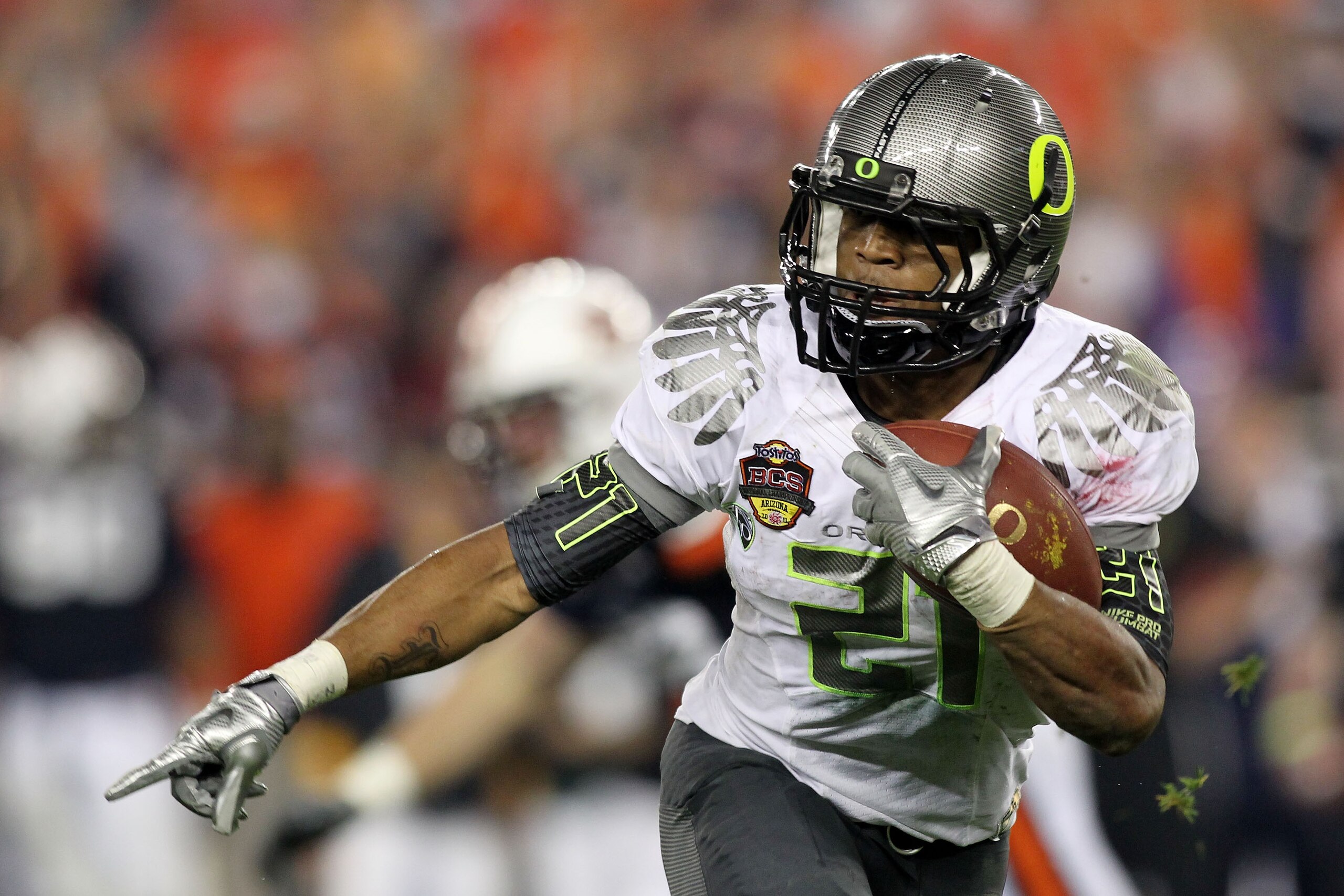 GLENDALE, AZ - JANUARY 10:  LaMichael James #21 of the Oregon Ducks runs down field against the Auburn Tigers during the Tostitos BCS National Championship Game at University of Phoenix Stadium on January 10, 2011 in Glendale, Arizona.  (Photo by Jonathan