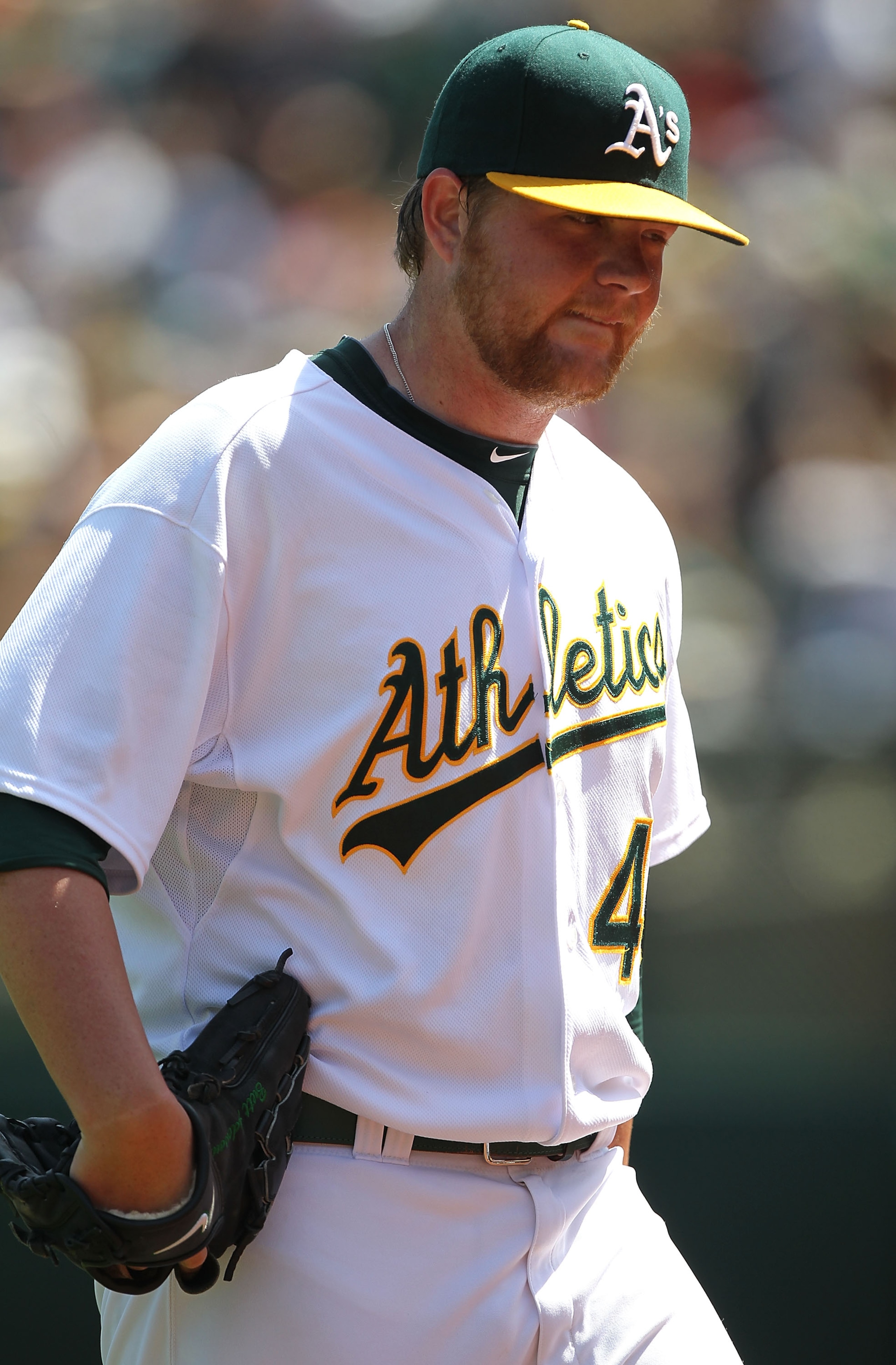 OAKLAND, CA - APRIL 18:  Brett Anderson #49 of the Oakland Athletics walks back to the dugout against the Baltimore Orioles after the fifth inning during an MLB game at the Oakland-Alameda County Coliseum on April 18, 2010 in Oakland, California.  (Photo