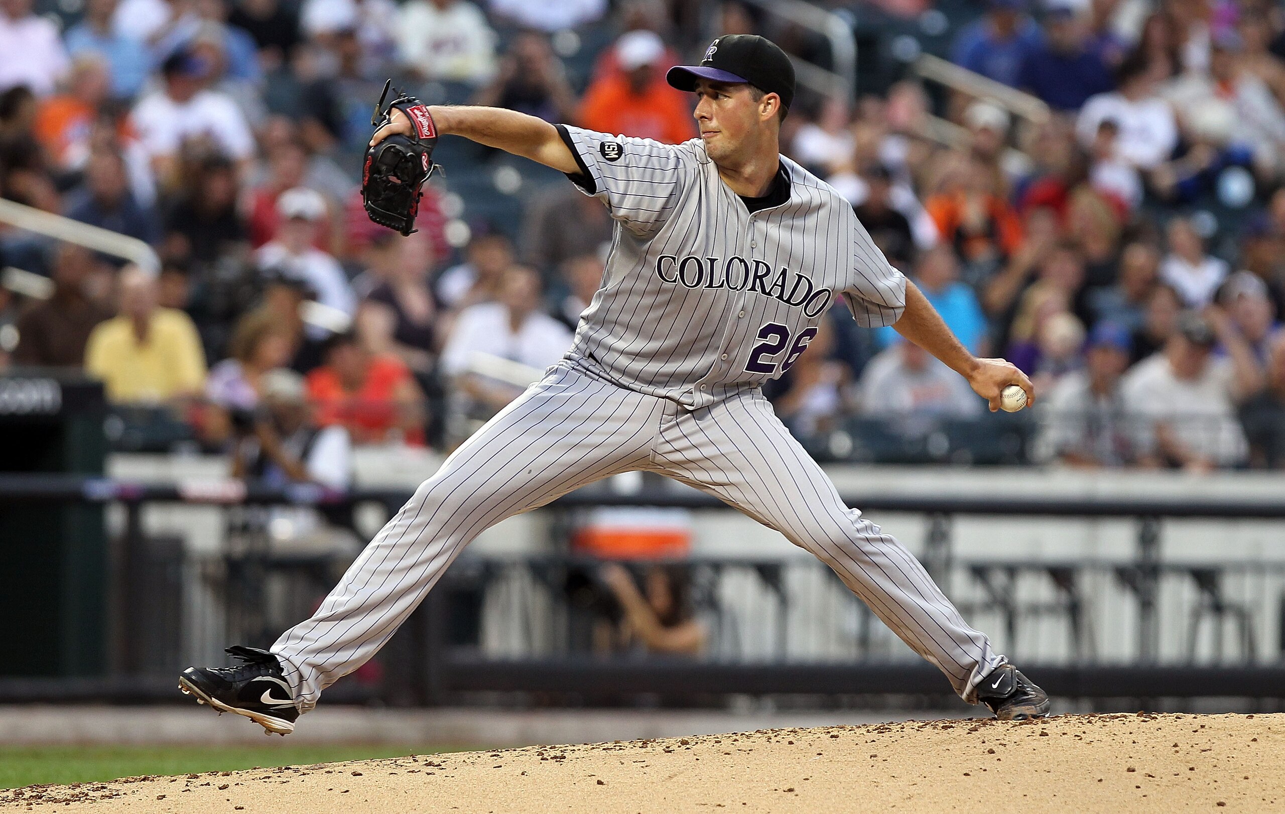 NEW YORK - AUGUST 11: Jeff Francis #26 of the Colorado Rockies pitches against the New York Mets at Citi Field on August 11, 2010 in the Flushing neighborhood of the Queens borough of New York City.  (Photo by Nick Laham/Getty Images)