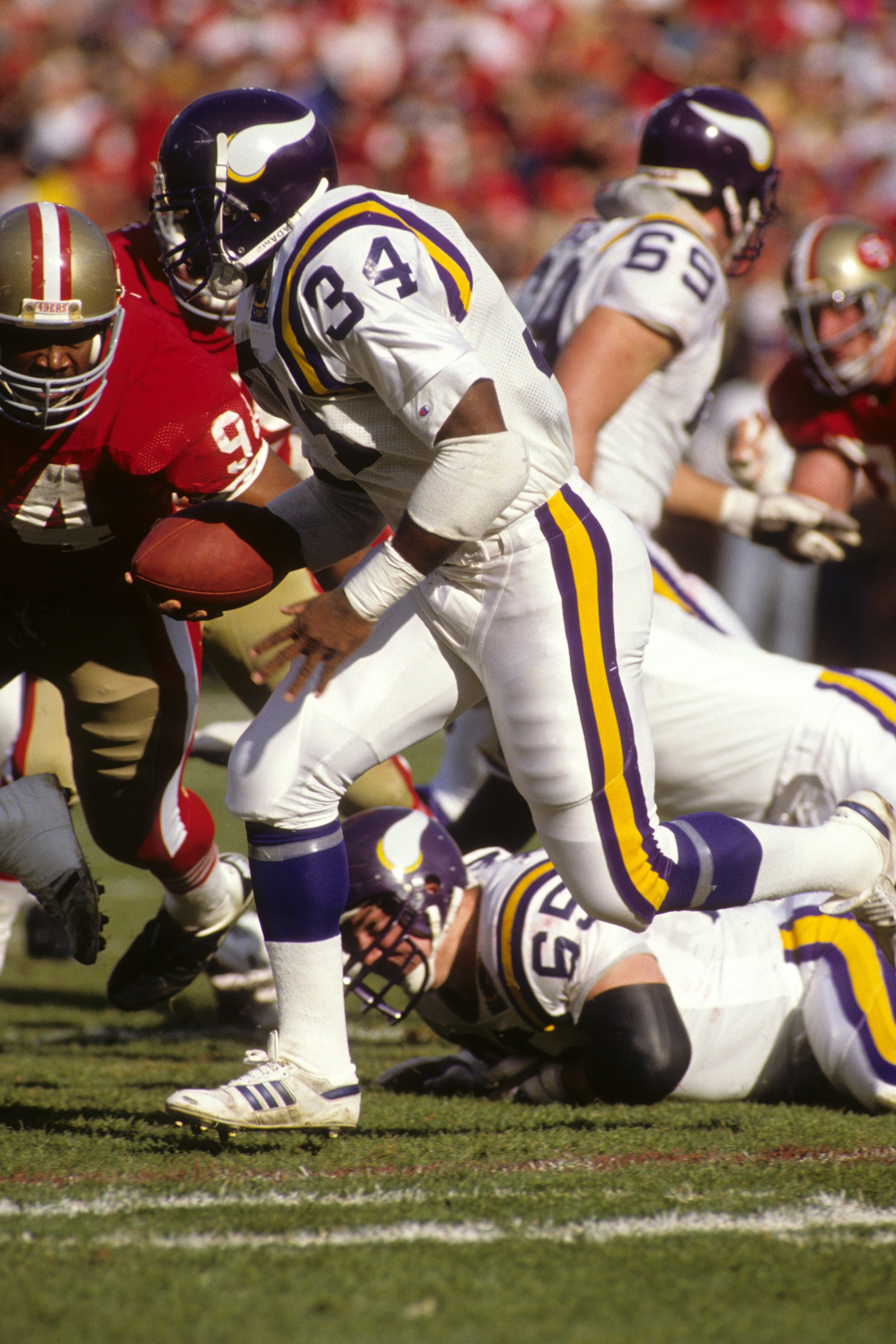 SAN FRANCISCO - JANUARY 6:  Running back Herschel Walker #34 of the Minnesota Vikings rushes for yards during the 1989 NFC Divisional Playoff game against the San Francisco 49ers at Candlestick Park on January 6, 1990 in San Francisco, California.  The 49
