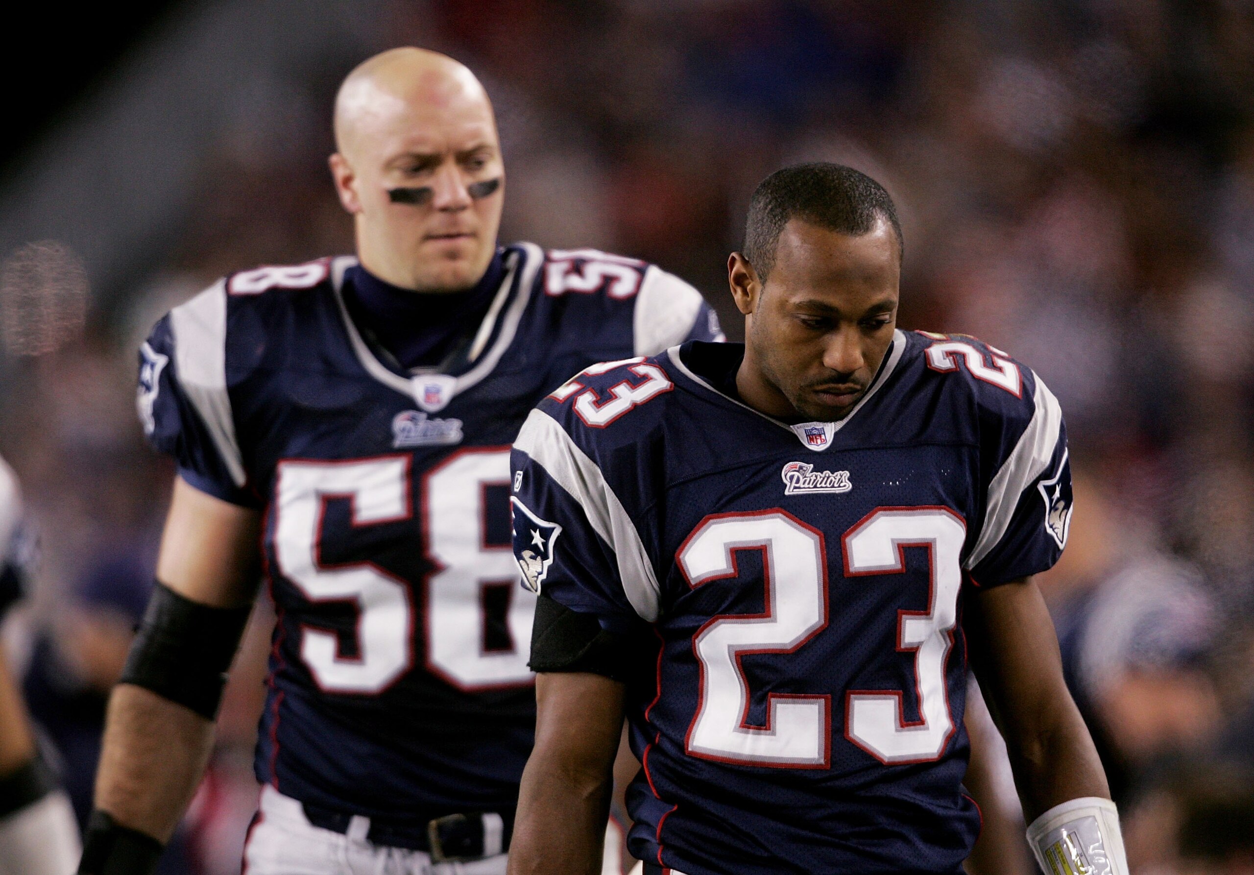 FOXBORO, MA - NOVEMBER 07:  Duane Starks #23 and Matt Chatham #58 both of the New England Patriots walk along the bench during their 40-21 loss to the Indianapolis Colts at Gillette Stadium on November 7, 2005 in Foxboro, Massachusetts.  (Photo by Nick La