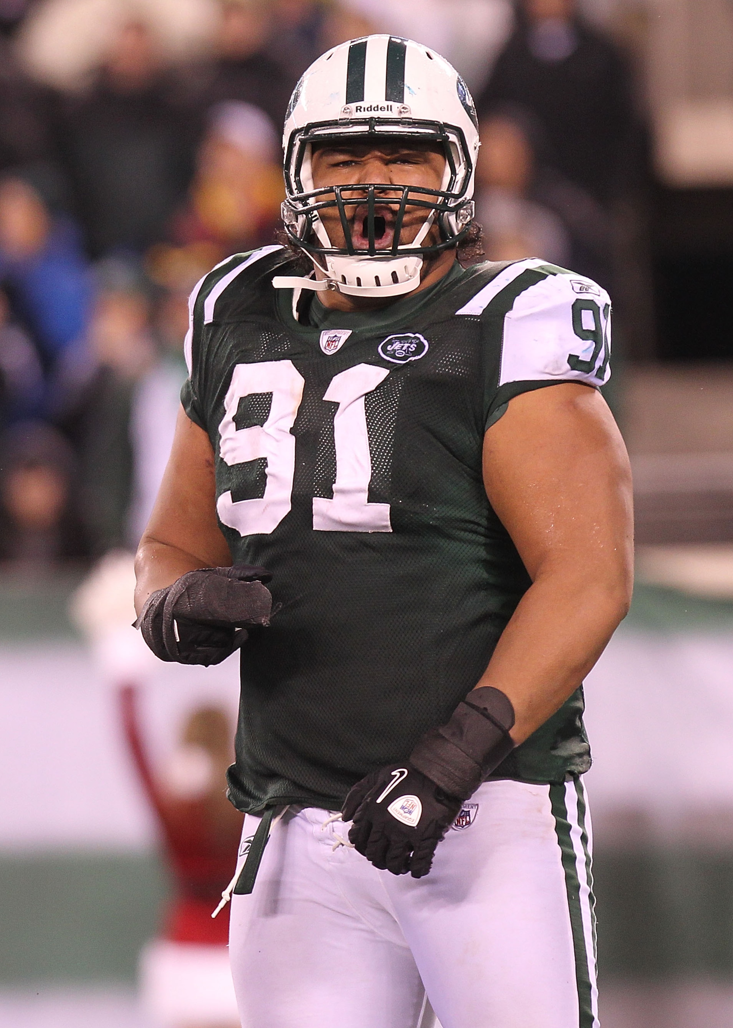EAST RUTHERFORD, NJ - DECEMBER 12:  Sione Pouha #91 of the New York Jets reacts the Miami Dolphins at New Meadowlands Stadium on December 12, 2010 in East Rutherford, New Jersey.  (Photo by Nick Laham/Getty Images)