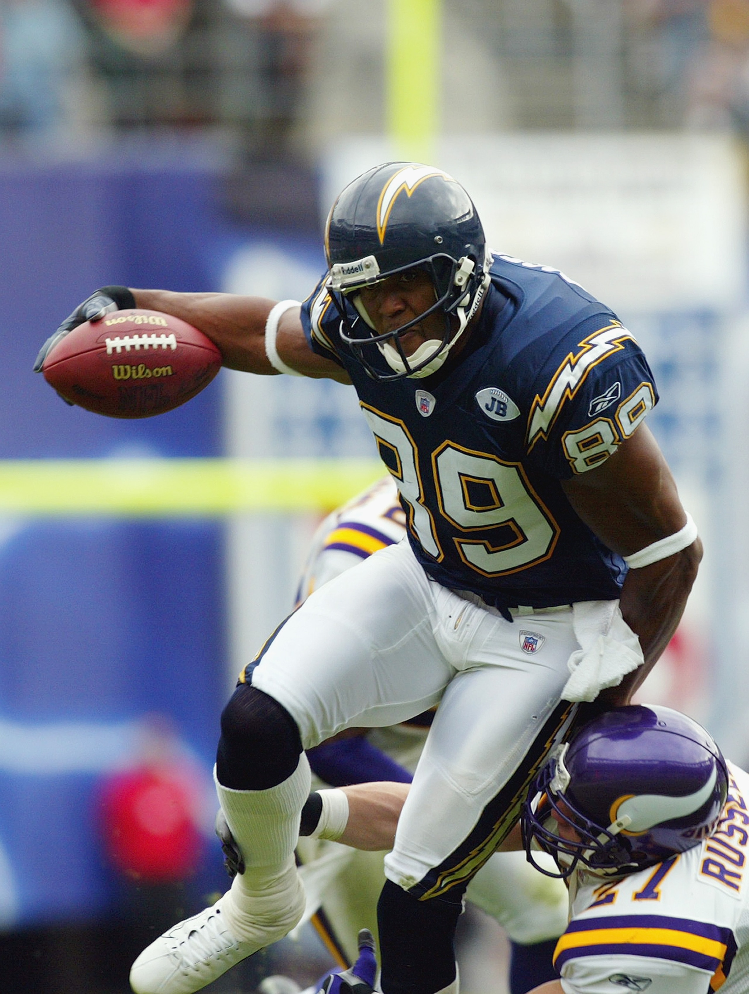 SAN DIEGO - NOVEMBER 9:  David Boston #89 of the San Diego Chargers runs past Brian Russell #27 of the Minnesota Vikings on November 9, 2003 at Qualcomm Stadium in San Diego, California.  The Chargers defeated the Vikings 42-28.  (Photo by Donald Miralle/