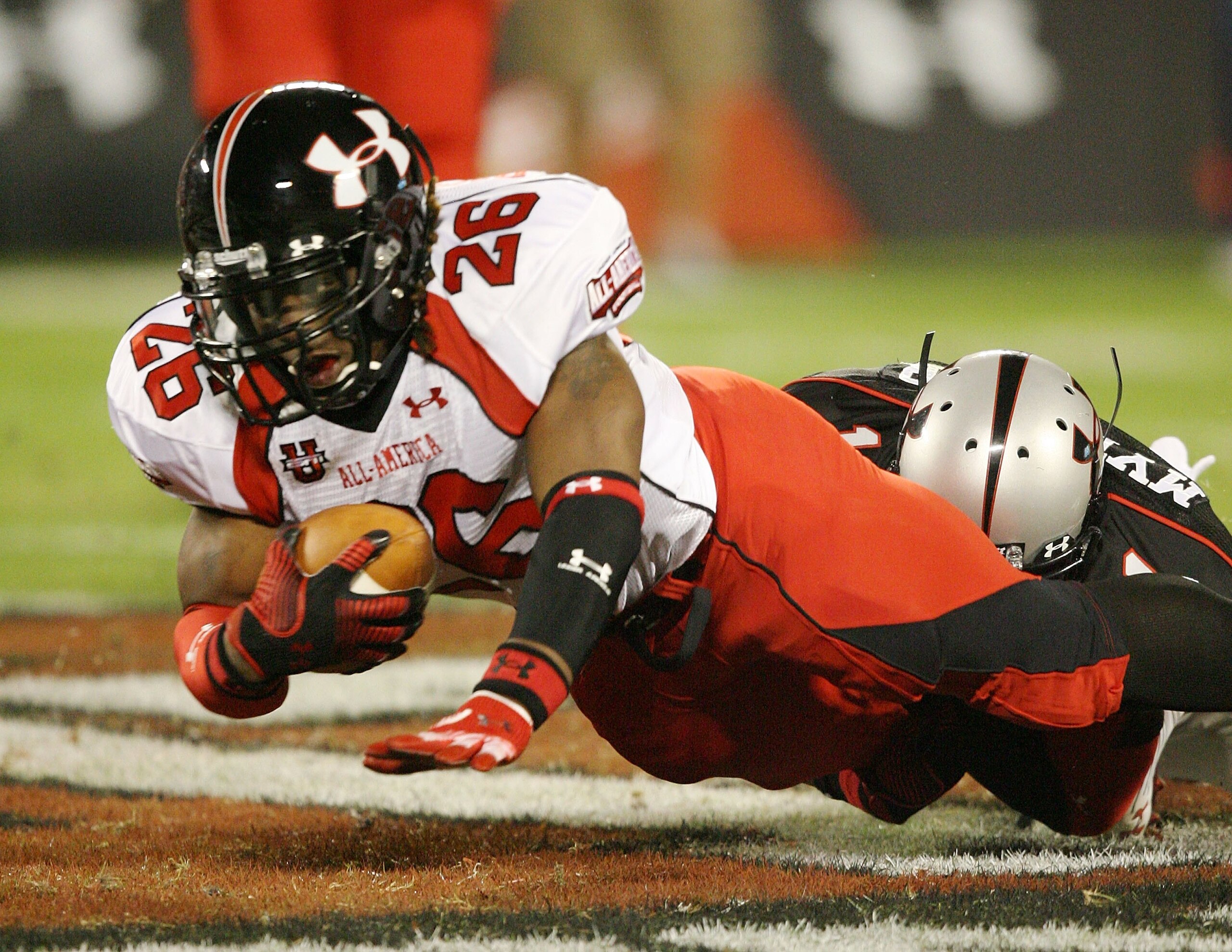 ORLANDO, FL - JANUARY 04:  Running back Trent Richardson #26 of the white team is brought down by safety Darren Myles Jr. #1 of the black team in the All America Under Armour Football Game at Florida Citrus Bowl on January 4, 2009 in Orlando, Florida.  (P