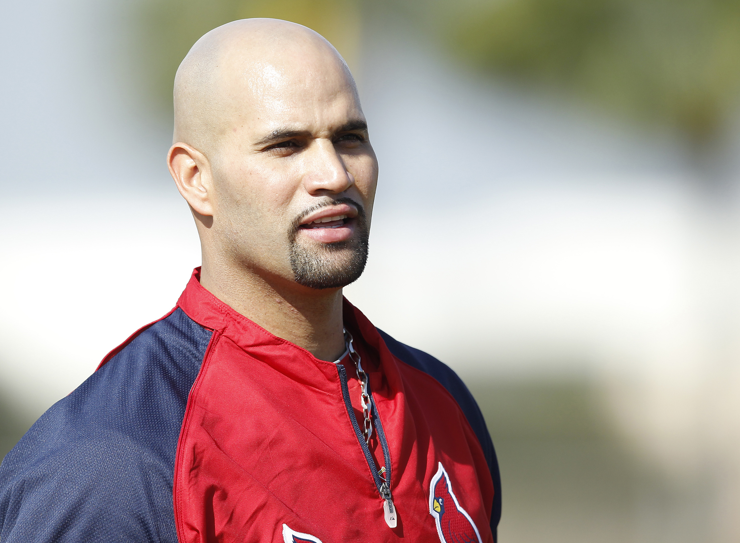 JUPITER, FL - FEBRUARY 17: Albert Pujols #5 of the St. Louis Cardinals  takes a rest during fielding practice at Roger Dean Stadium on February 17, 2011 in Jupiter, Florida. (Photo by Joel Auerbach/Getty Images)