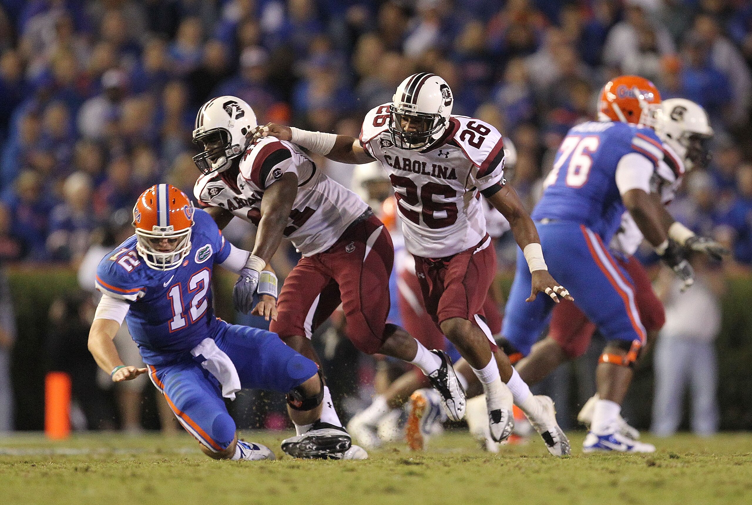 GAINESVILLE, FL - NOVEMBER 13: Josh Dickerson #41 and Antonio Allen #26 of the South Carolina Gamecocks knock down quarterback John Brantley #12 of the Florida Gators during a game at Ben Hill Griffin Stadium on November 13, 2010 in Gainesville, Florida. GAINESVILLE, FL - NOVEMBER 13: Josh Dickerson #41 and Antonio Allen #26 of the South Carolina Gamecocks knock down quarterback John Brantley #12 of the Florida Gators during a game at Ben Hill Griffin Stadium on November 13, 2010 in Gainesville, Florida.