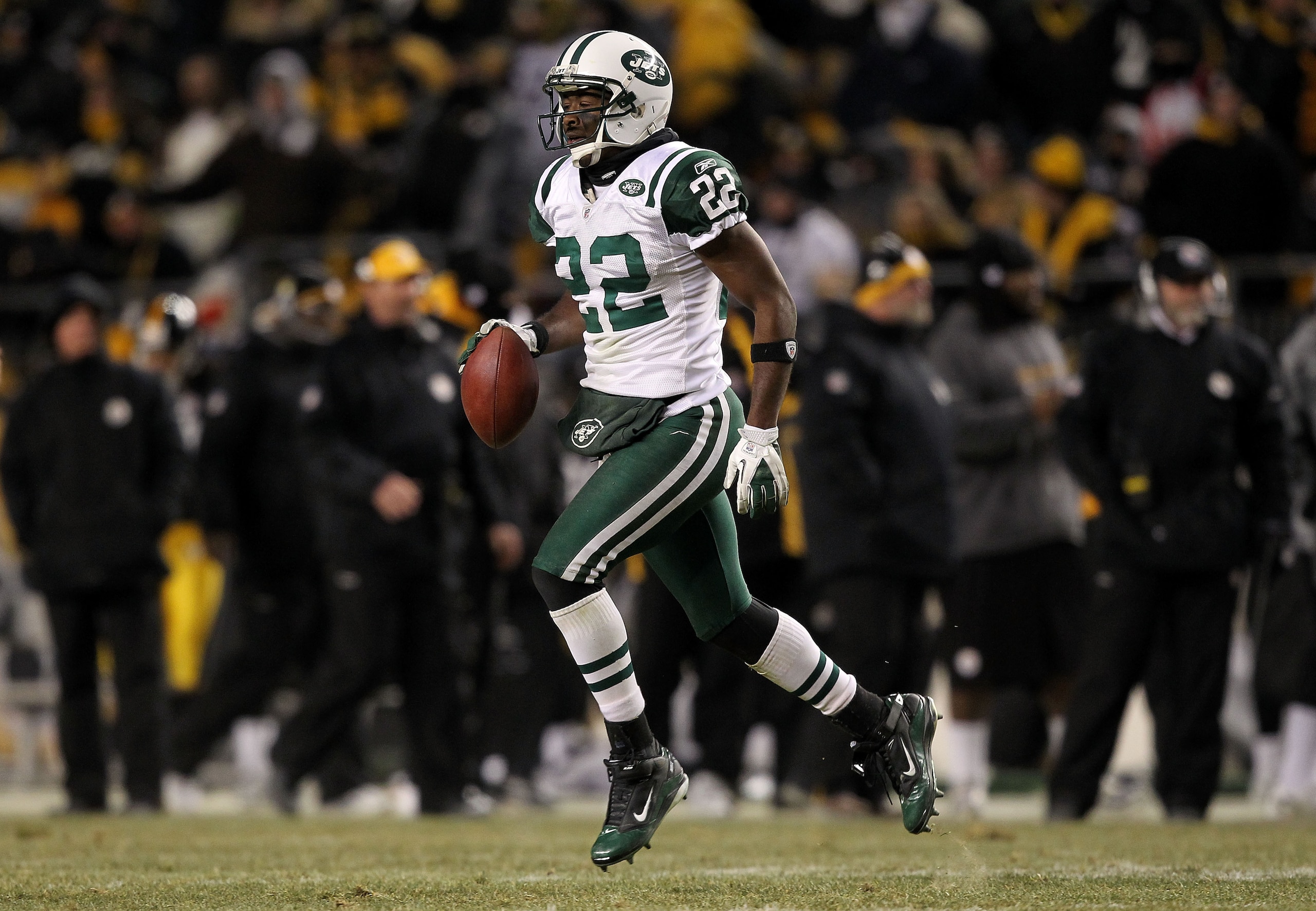 PITTSBURGH, PA - JANUARY 23:  Brodney Pool #22 of the New York Jets runs down field after intercepting a pass intended for Emmanuel Sanders #88 of the Pittsburgh Steelers in the third quarter of the 2011 AFC Championship game at Heinz Field on January 23,