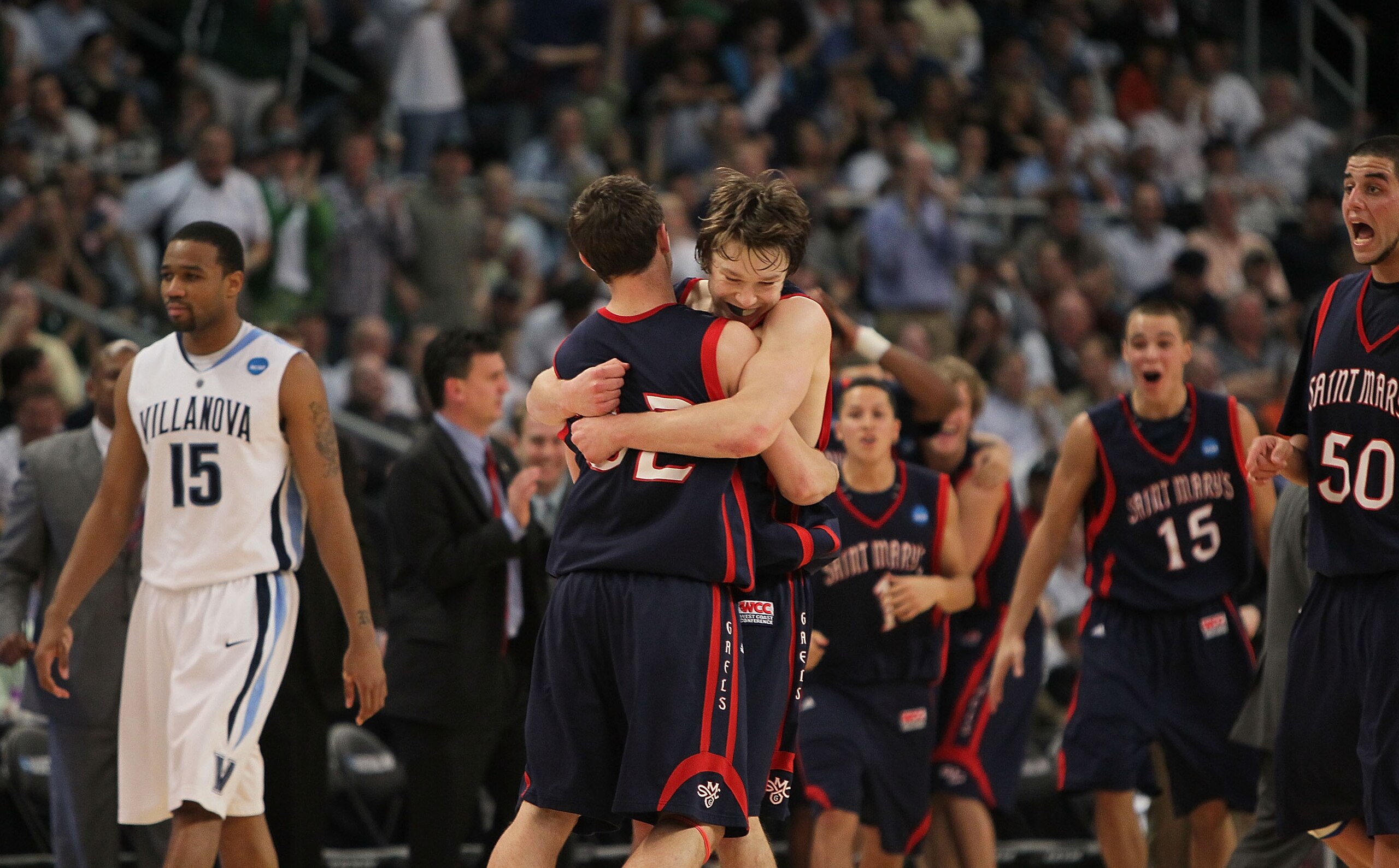 PROVIDENCE, RI - MARCH 20:  Mickey McConnell #32 is hugged by Matthew Dellavedova #4 of the Saint Mary's Gaels after a win over the Villanova Wildcats during the second round of the 2010 NCAA men's tournament at Dunkin' Donuts Center on March 20, 2010 in