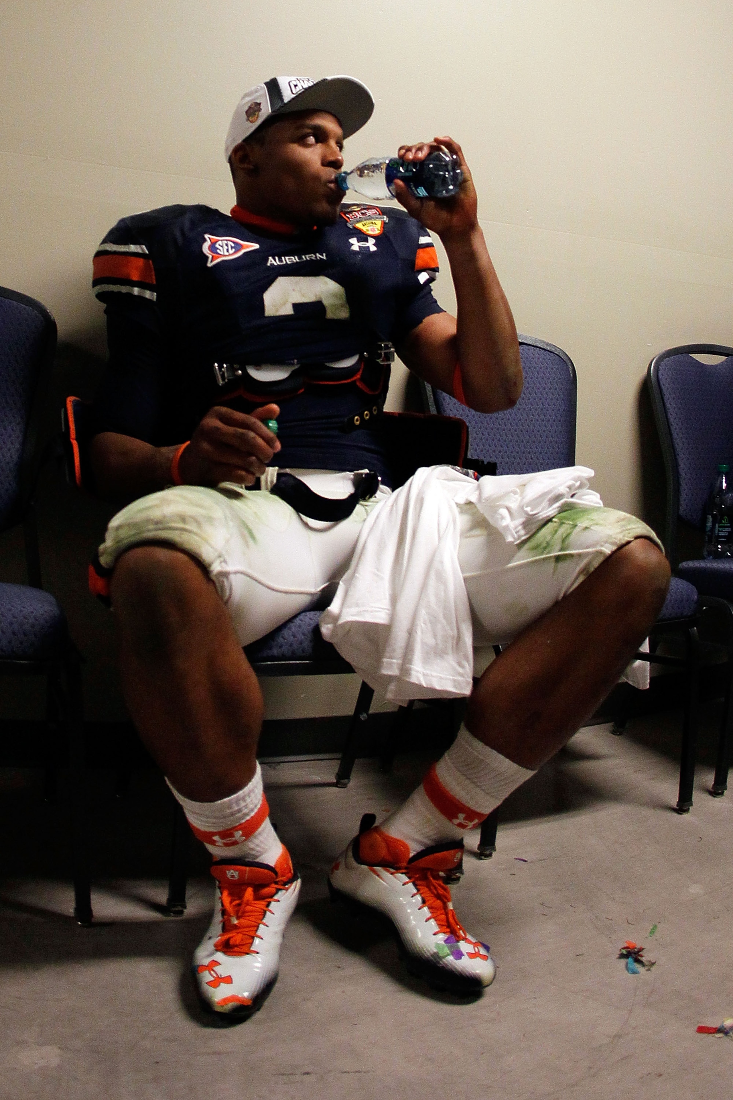GLENDALE, AZ - JANUARY 10:  Quarterback Cameron Newton #2 of the Auburn Tigers drinks water in the hallway minutes after the Tigers 22-19 victory against the Oregon Ducks in the Tostitos BCS National Championship Game at University of Phoenix Stadium on J