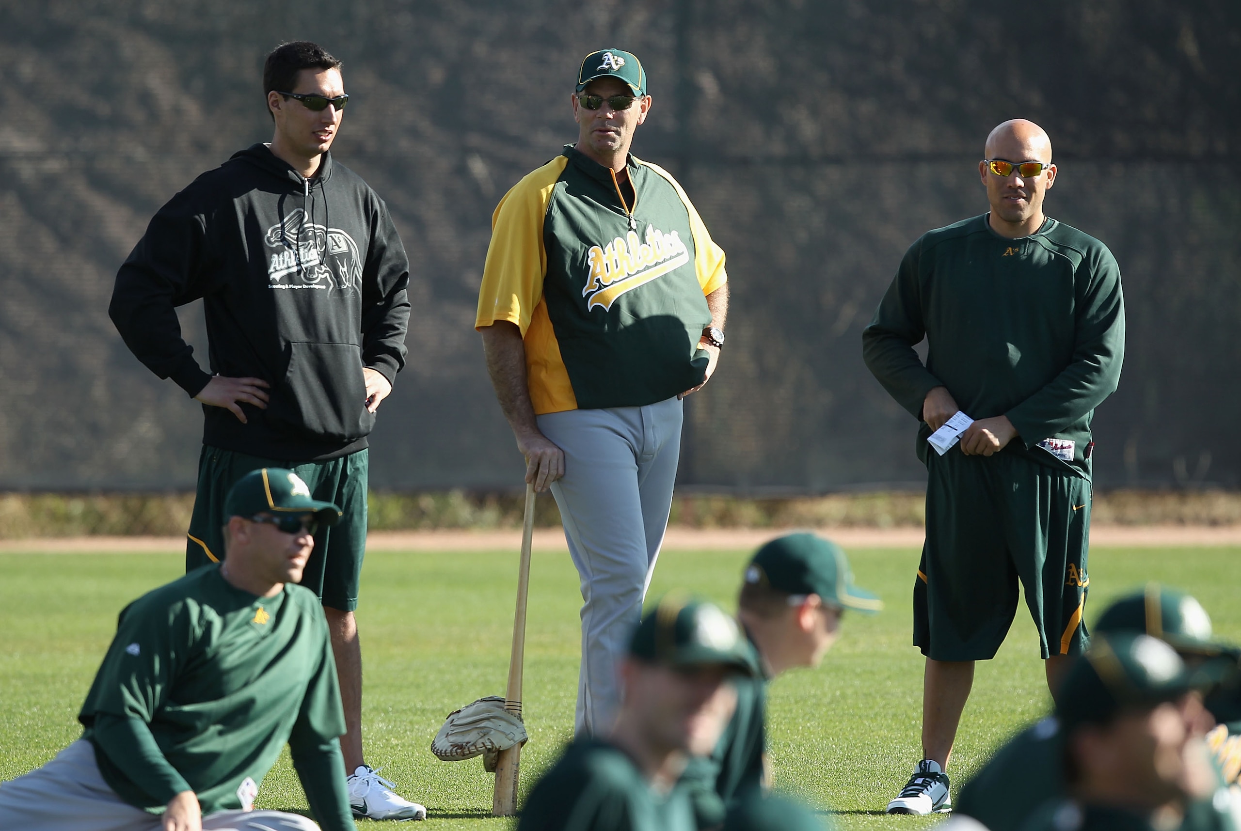 PHOENIX, AZ - FEBRUARY 16:  Pitching coach Ron Romanick (C) of the Oakland Athletics during a MLB spring training practice at Phoenix Municipal Stadium on March 17, 2011 in Phoenix, Arizona.  (Photo by Christian Petersen/Getty Images)