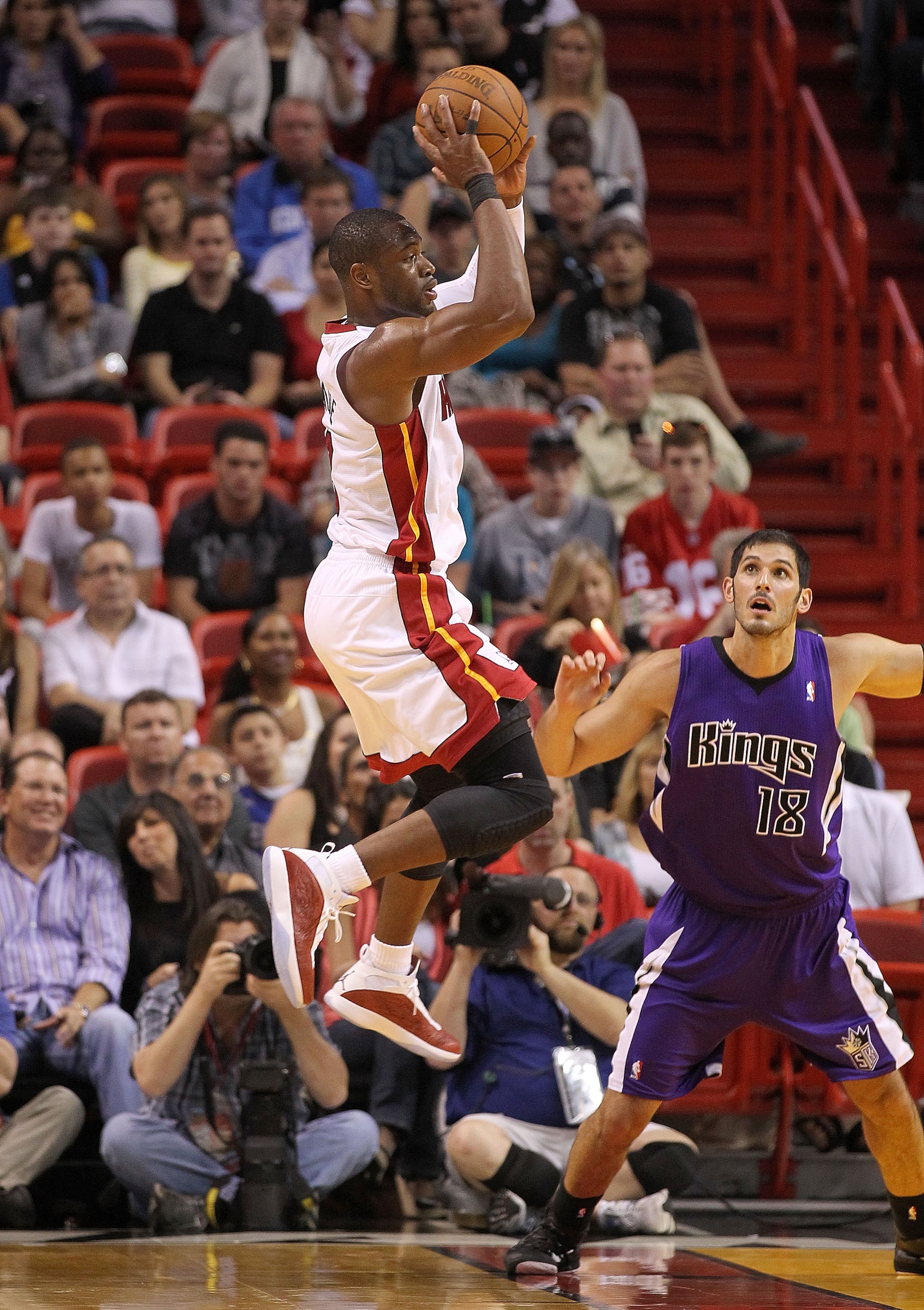 MIAMI, FL - FEBRUARY 22:  Dwyane Wade #3 of the Miami Heat looks to pass during a game against the Sacramento Kings at American Airlines Arena on February 22, 2011 in Miami, Florida. NOTE TO USER: User expressly acknowledges and agrees that, by downloadin