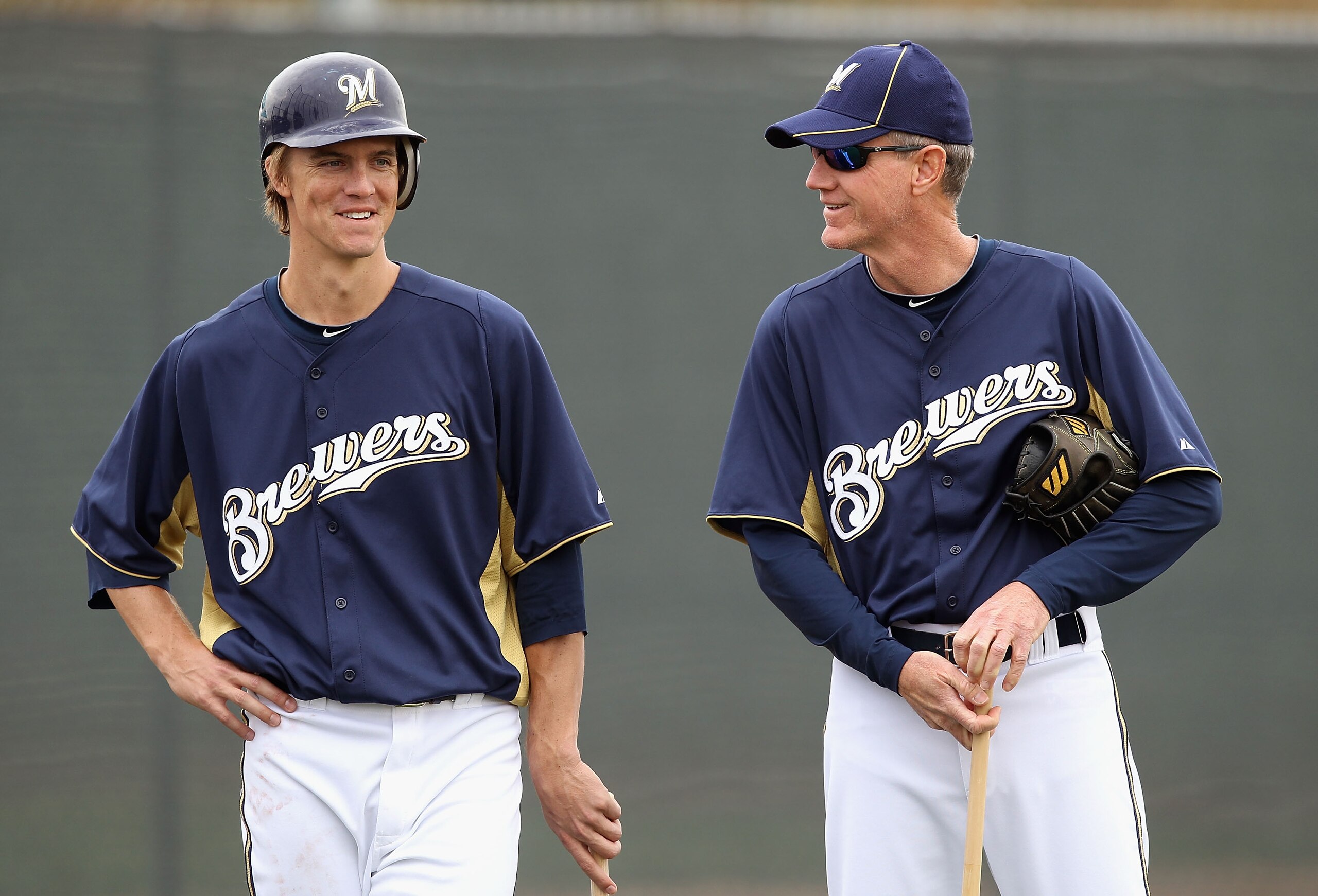 PHOENIX, AZ - FEBRUARY 18:  (L-R) Zack Greinke #13 and manager Ron Roenicke #10 of the Milwaukee Brewers talk during a MLB spring training practice at Maryvale Baseball Park on February 18, 2011 in Phoenix, Arizona.  (Photo by Christian Petersen/Getty Ima