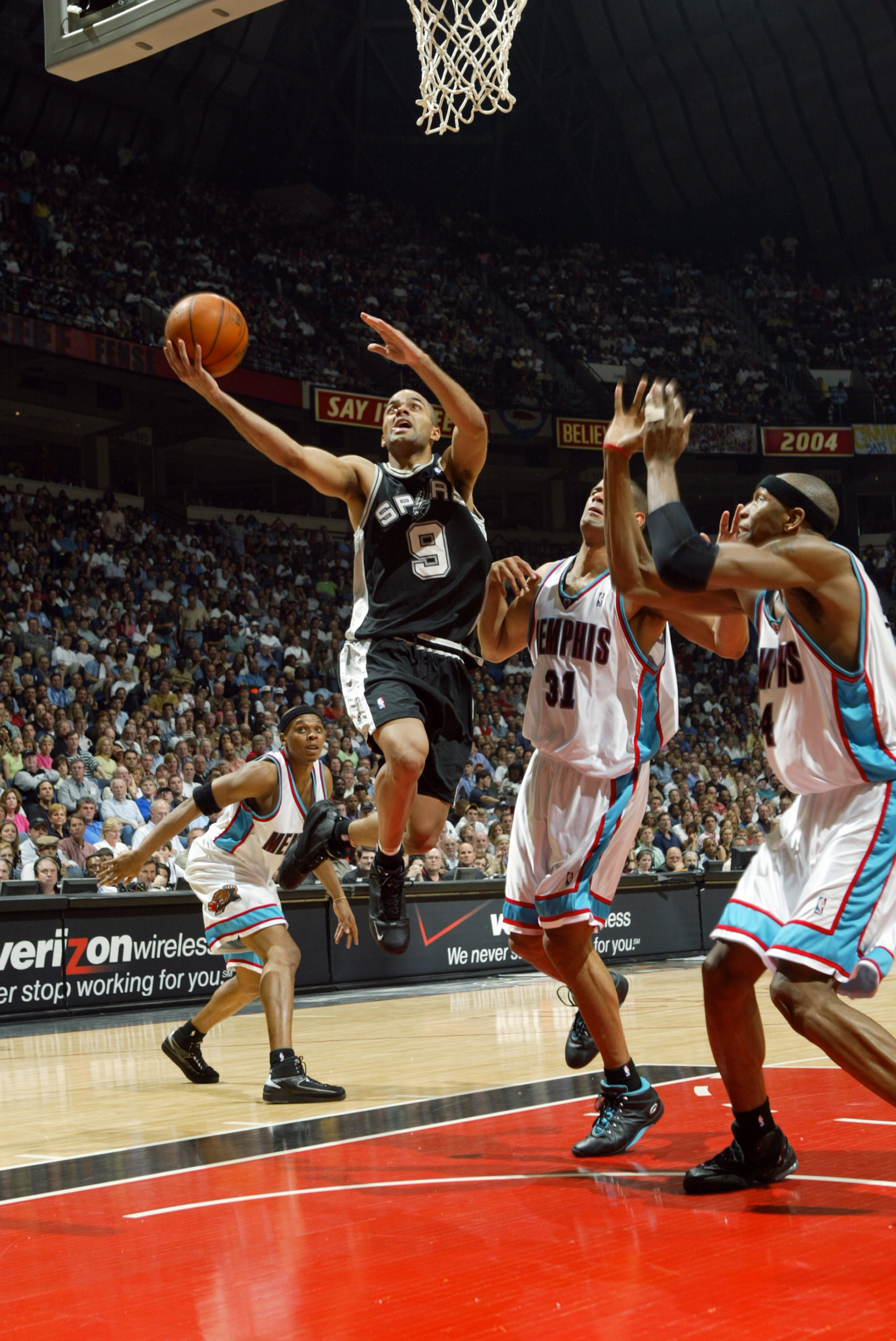MEMPHIS, TN - APRIL 22:  Tony Parker #9 of the San Antonio Spurs shoots a layup past Shane Battier #31 of the Memphis Grizzlies in Game three of the Western Conference Quarterfinals during the 2004 NBA playoffs at The Pyramid on April 22, 2004 in Memphis,