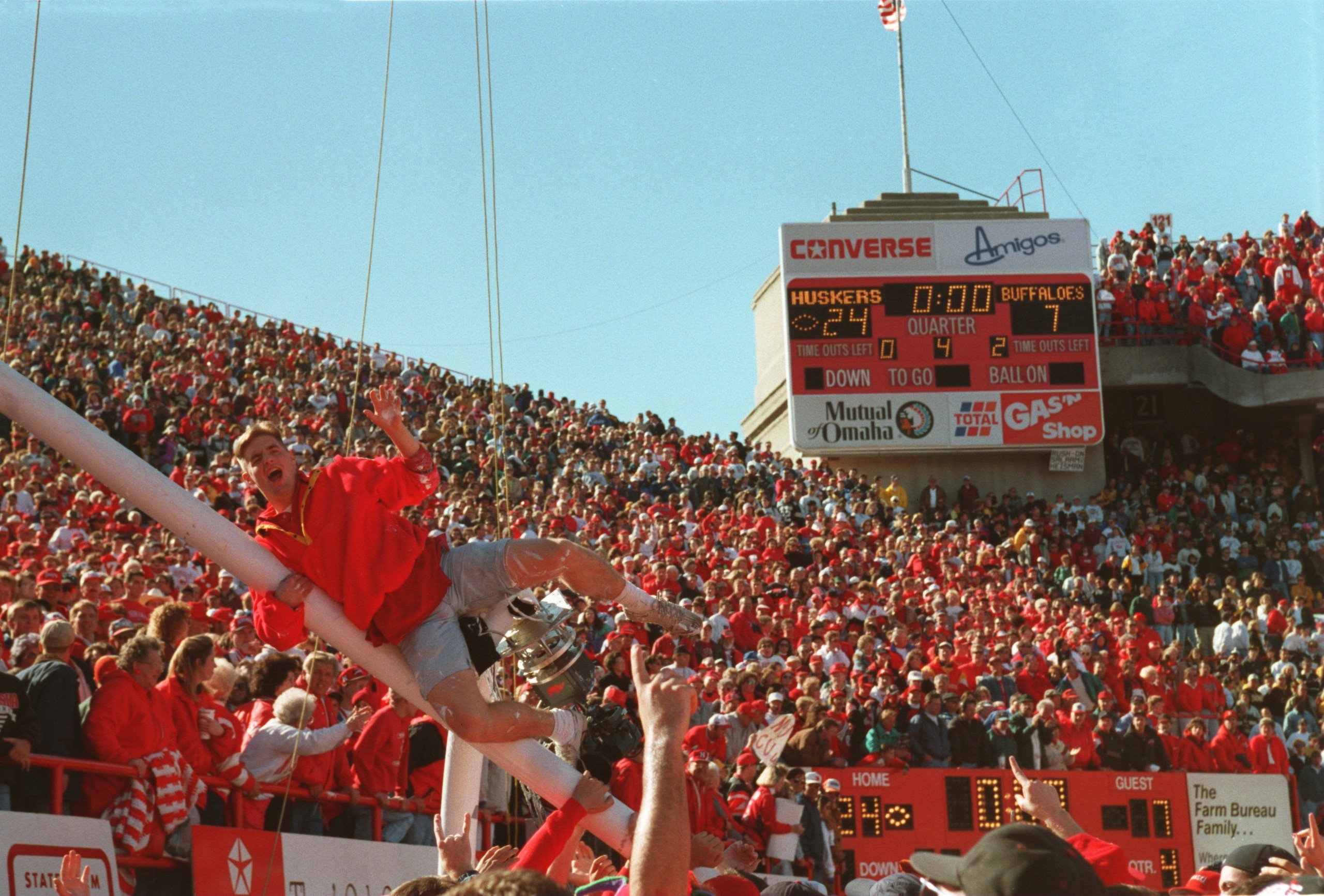 29 Oct 1994: University of Nebraska fans celebrate by climbing the goalpost prior to the Cornhuskers 24-7 win over the University of Colorado at Memorial Stadium in Lincoln, Nebraska. Mandatory Credit: Todd Rosenberg/ALLSPORT 29 Oct 1994: University of Nebraska fans celebrate by climbing the goalpost prior to the Cornhuskers 24-7 win over the University of Colorado at Memorial Stadium in Lincoln, Nebraska. Mandatory Credit: Todd Rosenberg/ALLSPORT