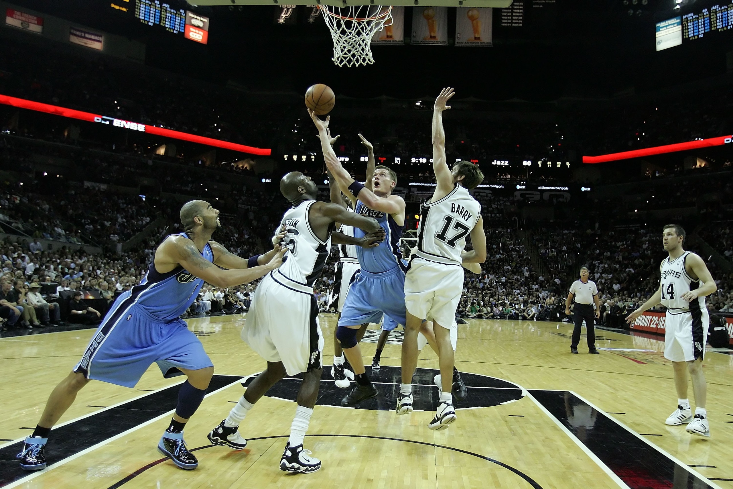 SAN ANTONIO - MAY 30:  Matt Harpring #15 of the Utah Jazz goes up for a shot against Francisco Elson #16 and Brent Barry #17 of the San Antonio Spurs in the fourth quarter of Game Five of the Western Conference Finals during the 2007 NBA Playoffs at AT&T