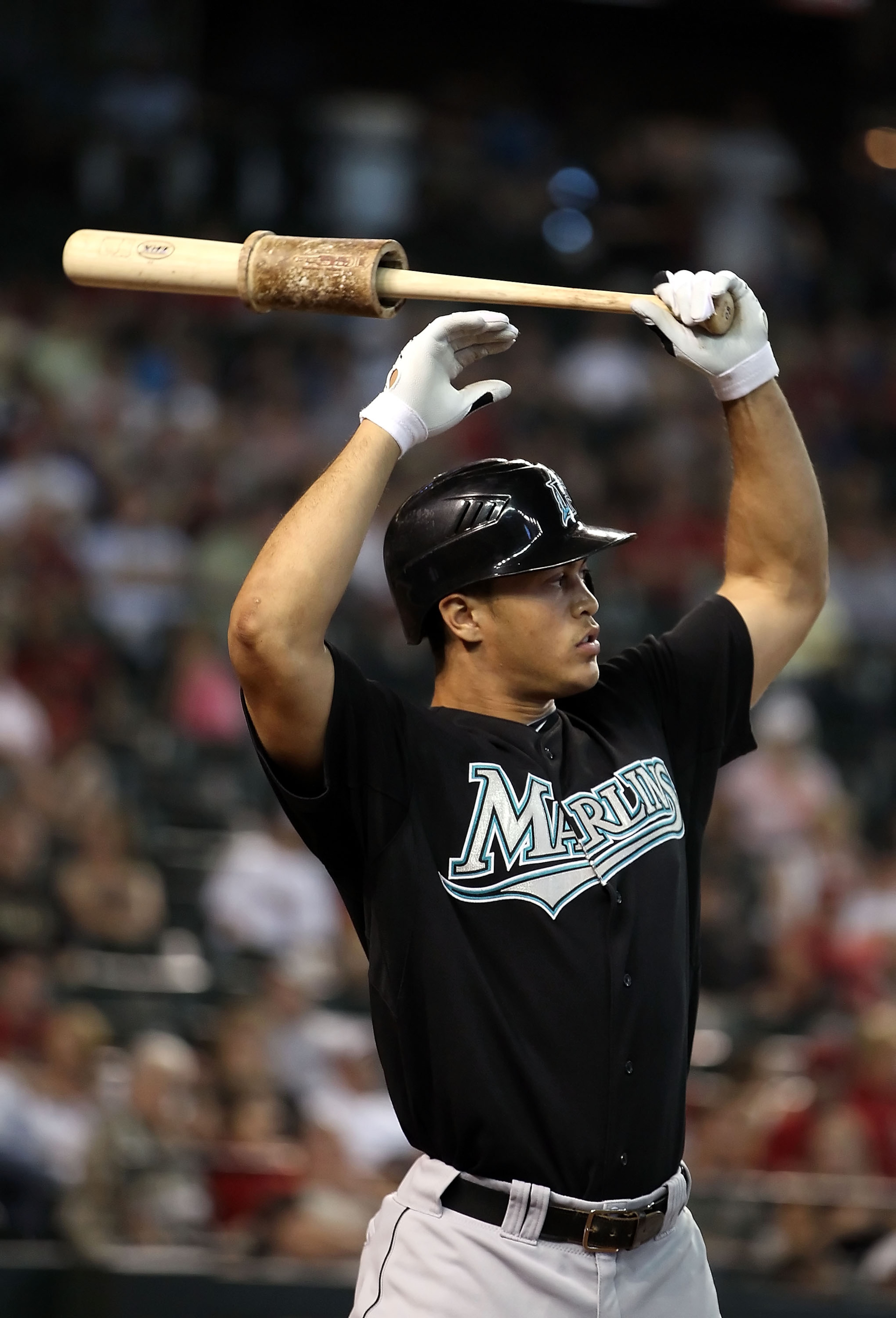 PHOENIX - JULY 11:  Mike Stanton #27 of the Florida Marlins warms up on deck during the Major League Baseball game against the Arizona Diamondbacks at Chase Field on July 11, 2010 in Phoenix, Arizona.  The Marlins defeated the Diamondbacks 2-0.  (Photo by