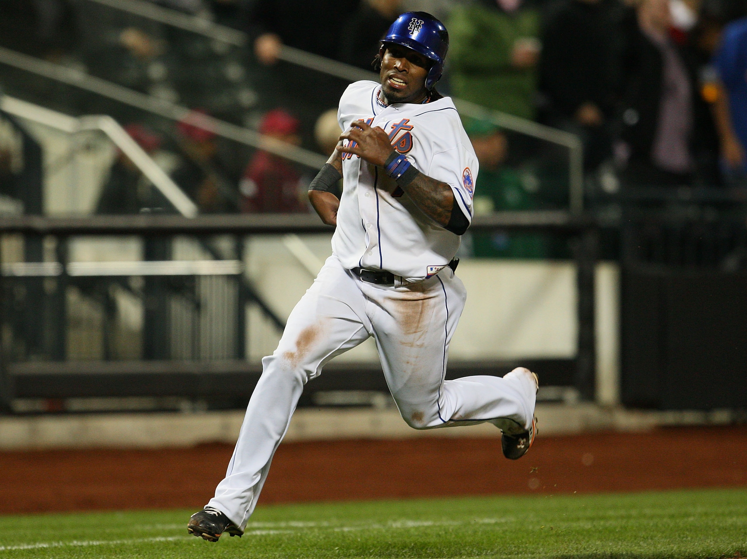 NEW YORK - APRIL 21:  Jose Reyes #7 of the New York Mets rounds third base and scores on a triple by teammate Luis Castillo (not shown) #1 in the eighth inning against the Chicago Cubs on April 21, 2010 at Citi Field in the Flushing neighborhood of the Qu