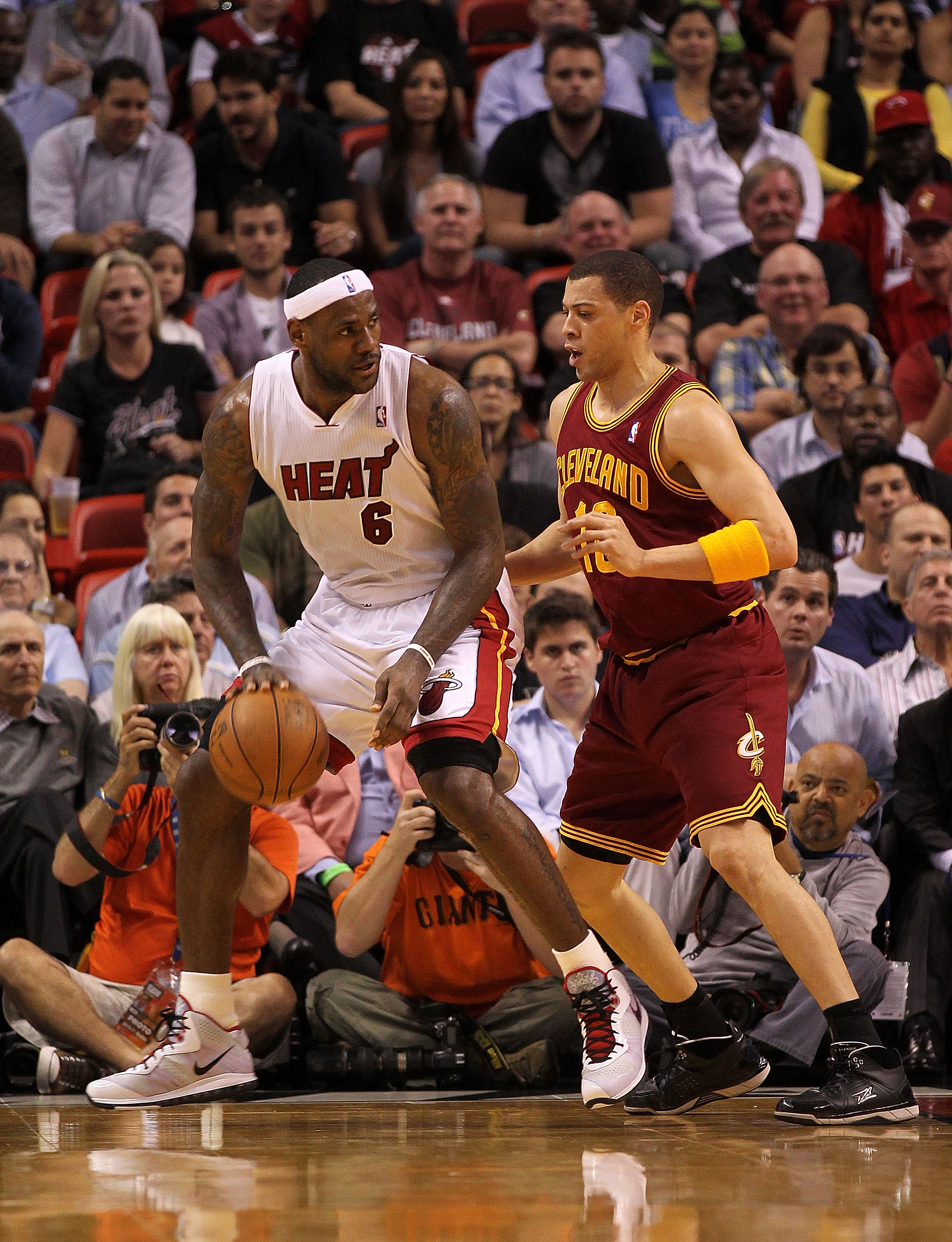 MIAMI, FL - JANUARY 31:  LeBron James #6 of the Miami Heat posts up Anthony Parker #18 of the Cleveland Cavaliers during a game at American Airlines Arena on January 31, 2011 in Miami, Florida. NOTE TO USER: User expressly acknowledges and agrees that, by