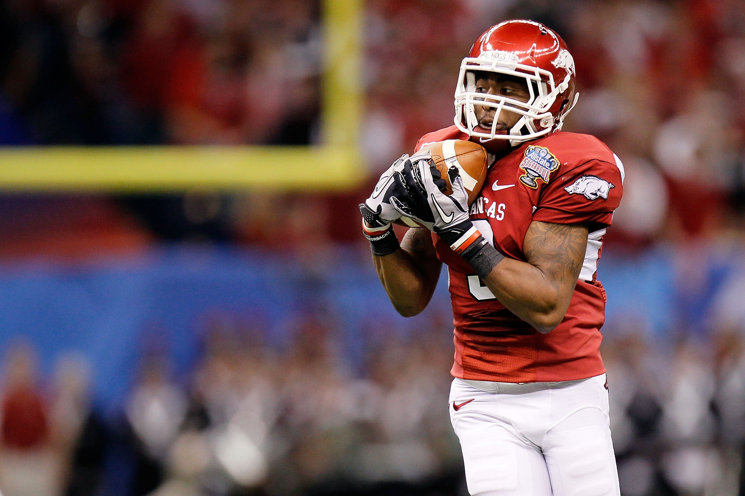 NEW ORLEANS, LA - JANUARY 04:  Joe Adams #3 of the Arkansas Razorbacks catches a pass against the Ohio State Buckeyes during the Allstate Sugar Bowl at the Louisiana Superdome on January 4, 2011 in New Orleans, Louisiana.  (Photo by Kevin C. Cox/Getty Ima