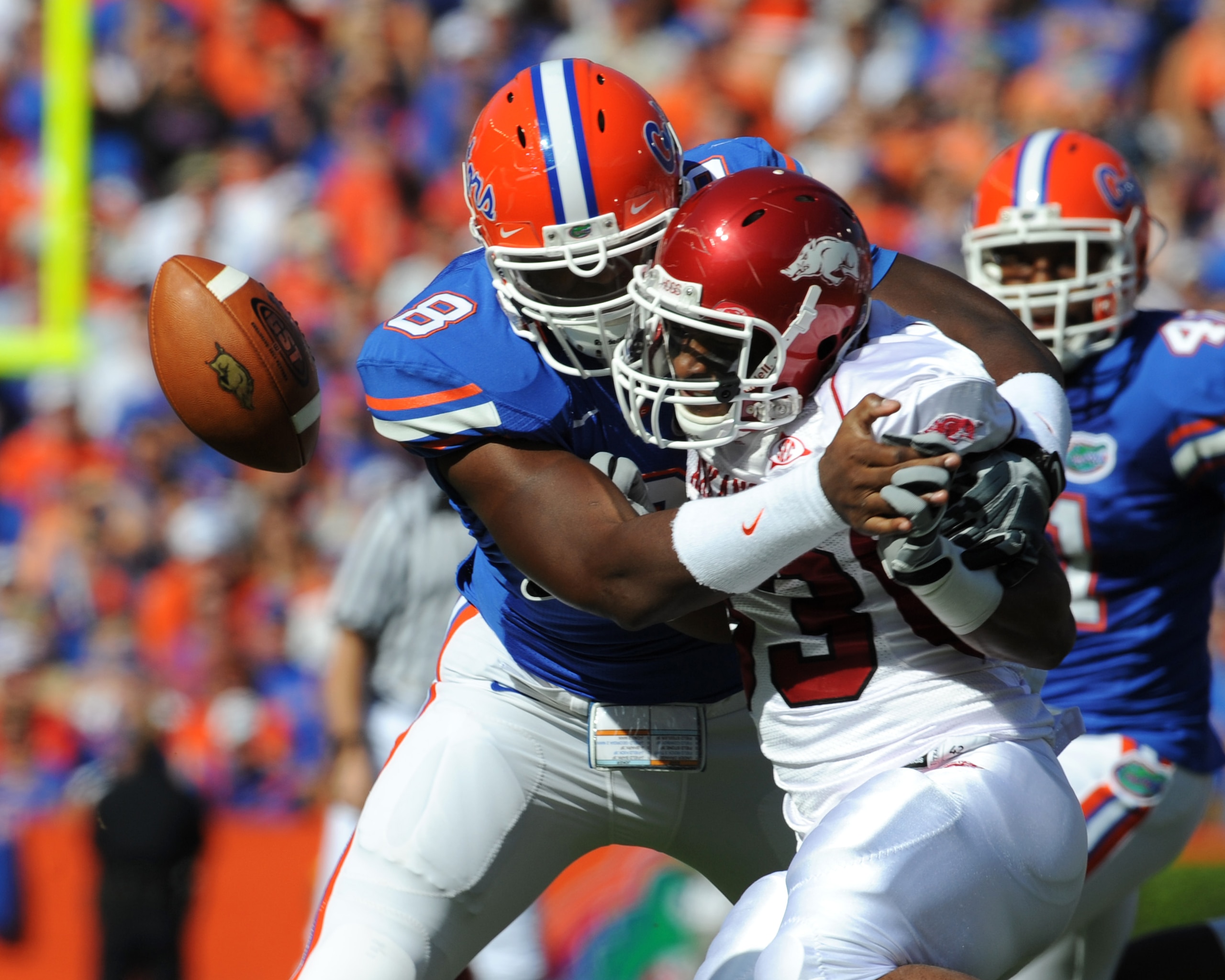 GAINESVILLE, FL - OCTOBER 17: Running back Dennis Johnson #33  of the Arkansas Razorbacks fumbles in the first quarter against the Florida Gators October 17, 2009 at Ben Hill Griffin Stadium in Gainesville, Florida.  (Photo by Al Messerschmidt/Getty Image