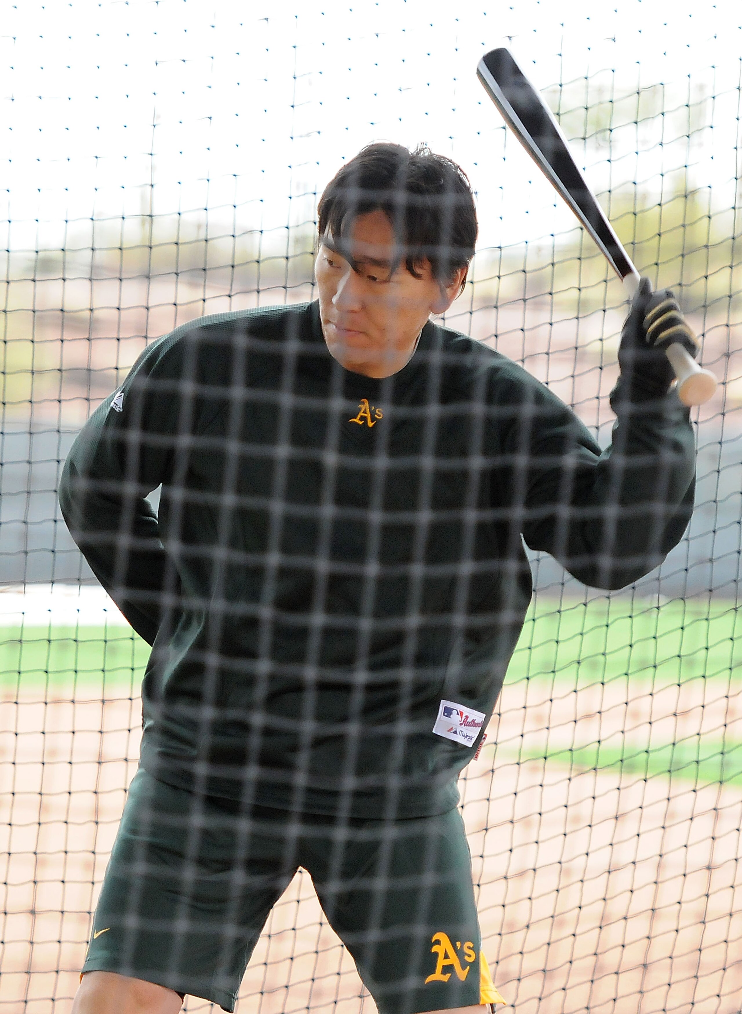PHOENIX, AZ - FEBRUARY 20:  Hideki Matsui #55 of the Oakland Athletics takes batting practice during spring work outs at Phoenix Municipal Stadium on February 20, 2011 in Phoenix, Arizona.  (Photo by Norm Hall/Getty Images)