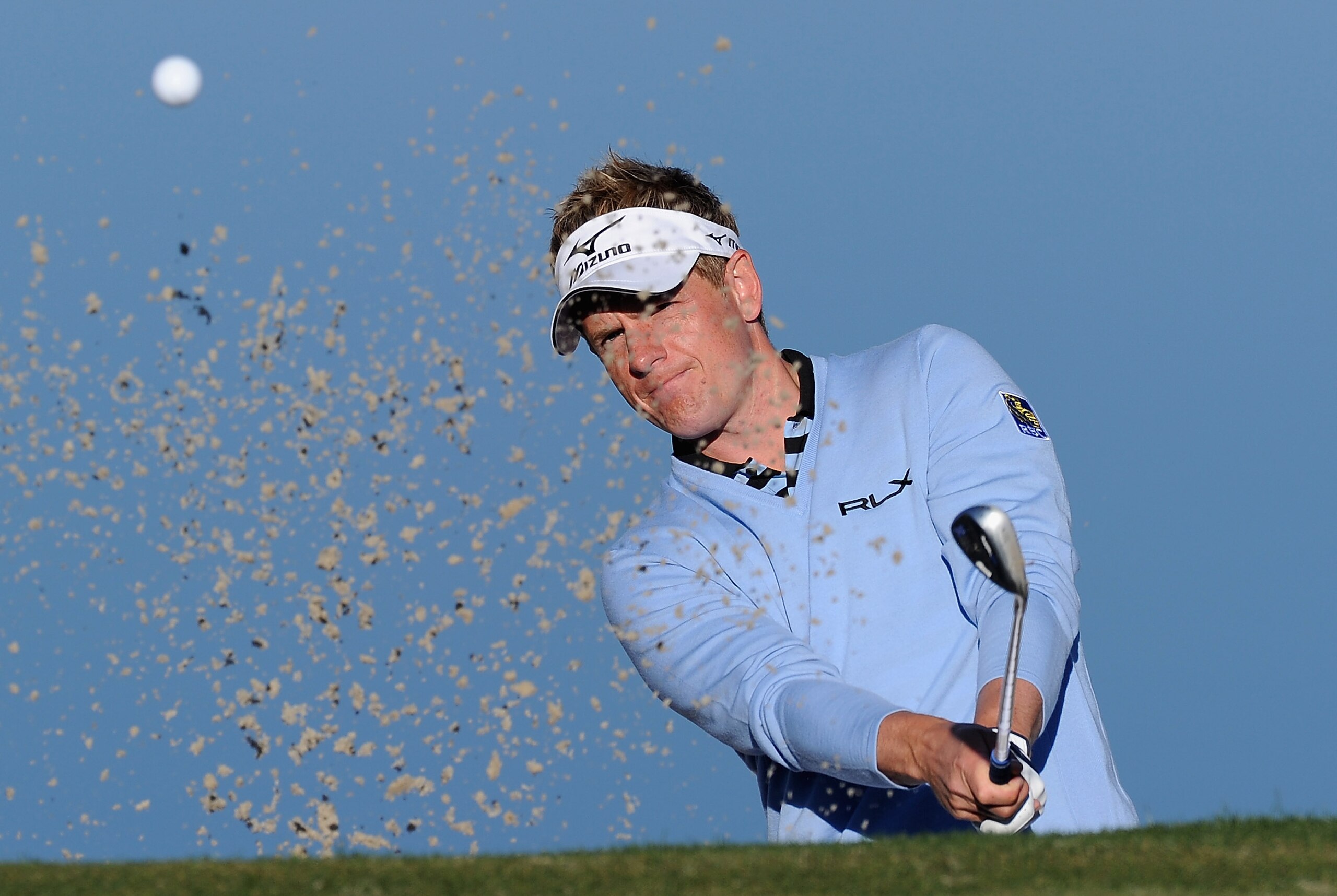 MARANA, AZ - FEBRUARY 22:  Luke Donald of England plays a bunker shot during practice prior to the start of the World Golf Championships-Accenture Match Play Championship held at The Ritz-Carlton Golf Club, Dove Mountain on February 22, 2011 in Marana, Ar