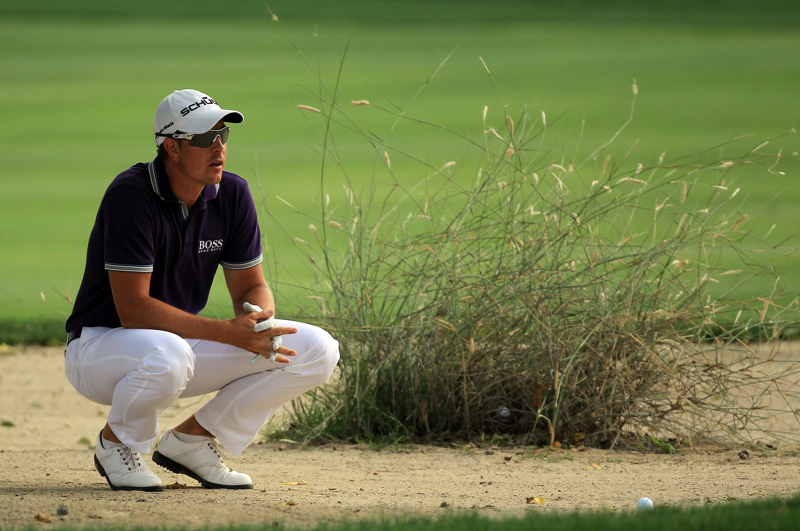 DUBAI, UNITED ARAB EMIRATES - FEBRUARY 11:  Henrik Stenson of Sweden plays his second shot at the par 4, 16th hole during the second round of the 2011 Omega Dubai Desert Classic on the Majilis Course at the Emirates Golf Club on February 11, 2011 in Dubai