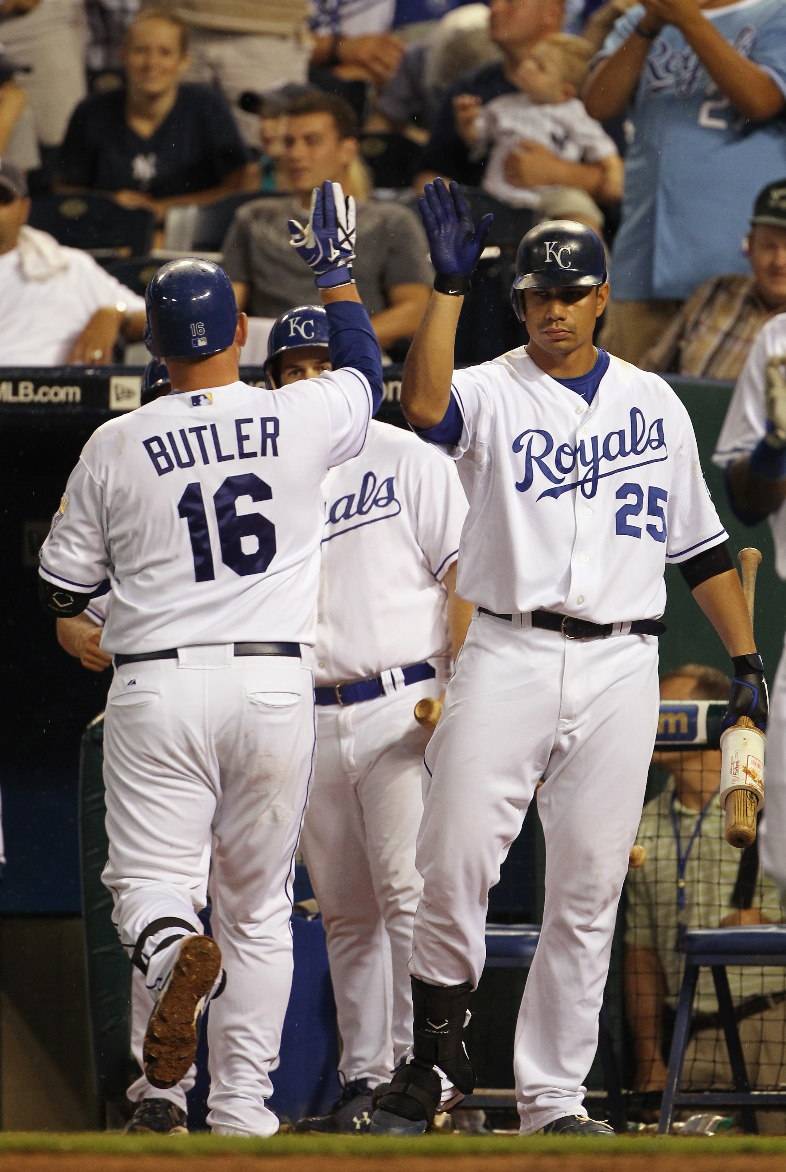 KANSAS CITY, MO - AUGUST 13:  Billy Butler #16 of the Kansas City Royals is congratulated by teammates after hitting a home run during the 5th inning of the game against the New York Yankees on August 13, 2010 at Kauffman Stadium in Kansas City, Missouri.