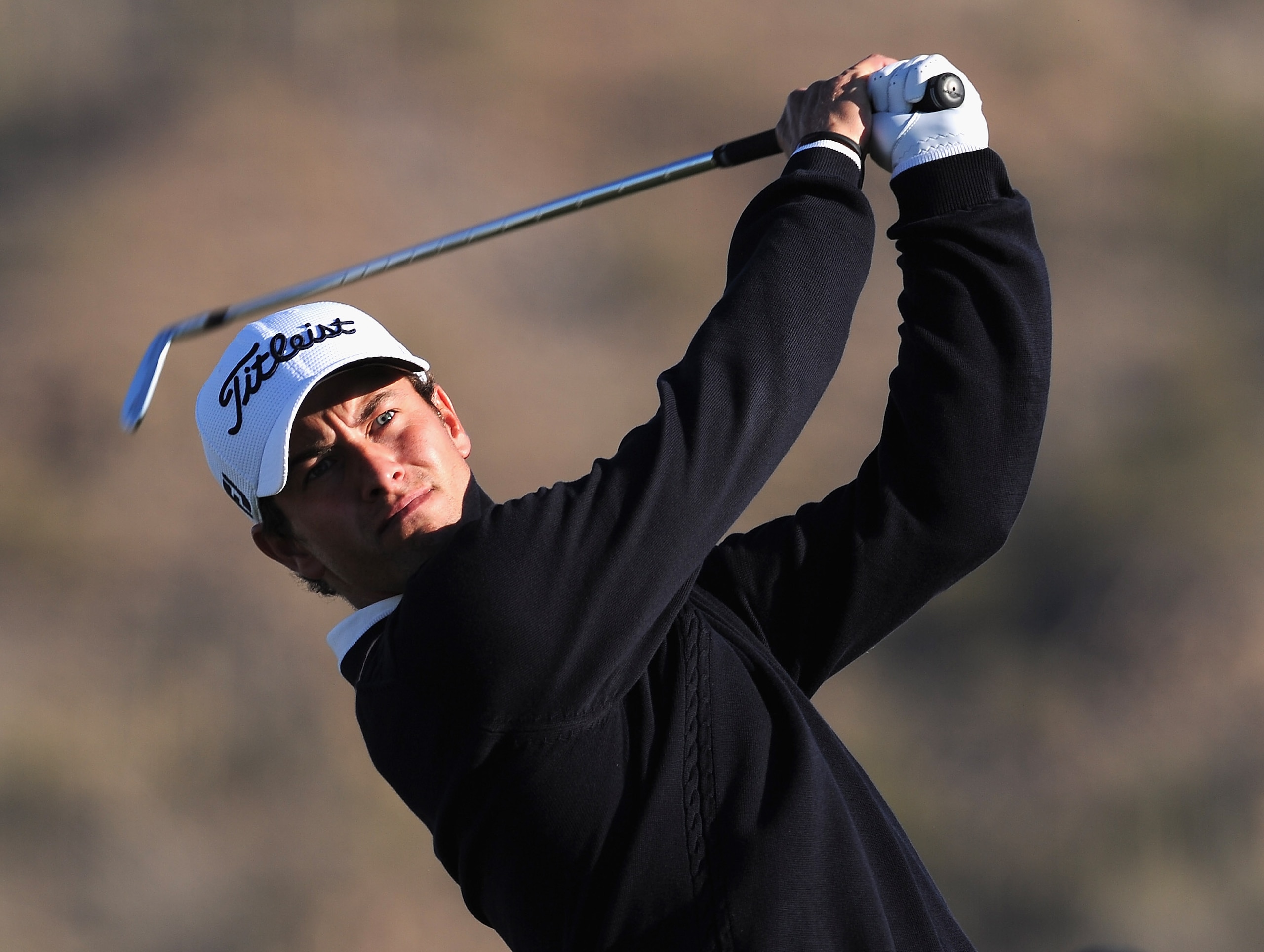 MARANA, AZ - FEBRUARY 22: Adam Scott of Australia plays a shot during practice prior to the start of the World Golf Championships-Accenture Match Play Championship held at The Ritz-Carlton Golf Club, Dove Mountain on February 22, 2011 in Marana, Arizona. MARANA, AZ - FEBRUARY 22: Adam Scott of Australia plays a shot during practice prior to the start of the World Golf Championships-Accenture Match Play Championship held at The Ritz-Carlton Golf Club, Dove Mountain on February 22, 2011 in Marana, Arizona.