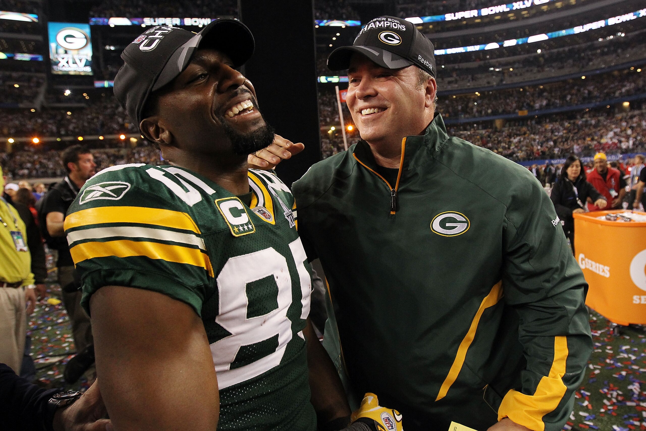 ARLINGTON, TX - FEBRUARY 06:  Greg Jennings #85 of the Green Bay Packers and head coach Mike McCarthy of the Green Bay Packers celebrate after they defeated the Steelers 31 to 25 in Super Bowl XLV at Cowboys Stadium on February 6, 2011 in Arlington, Texas