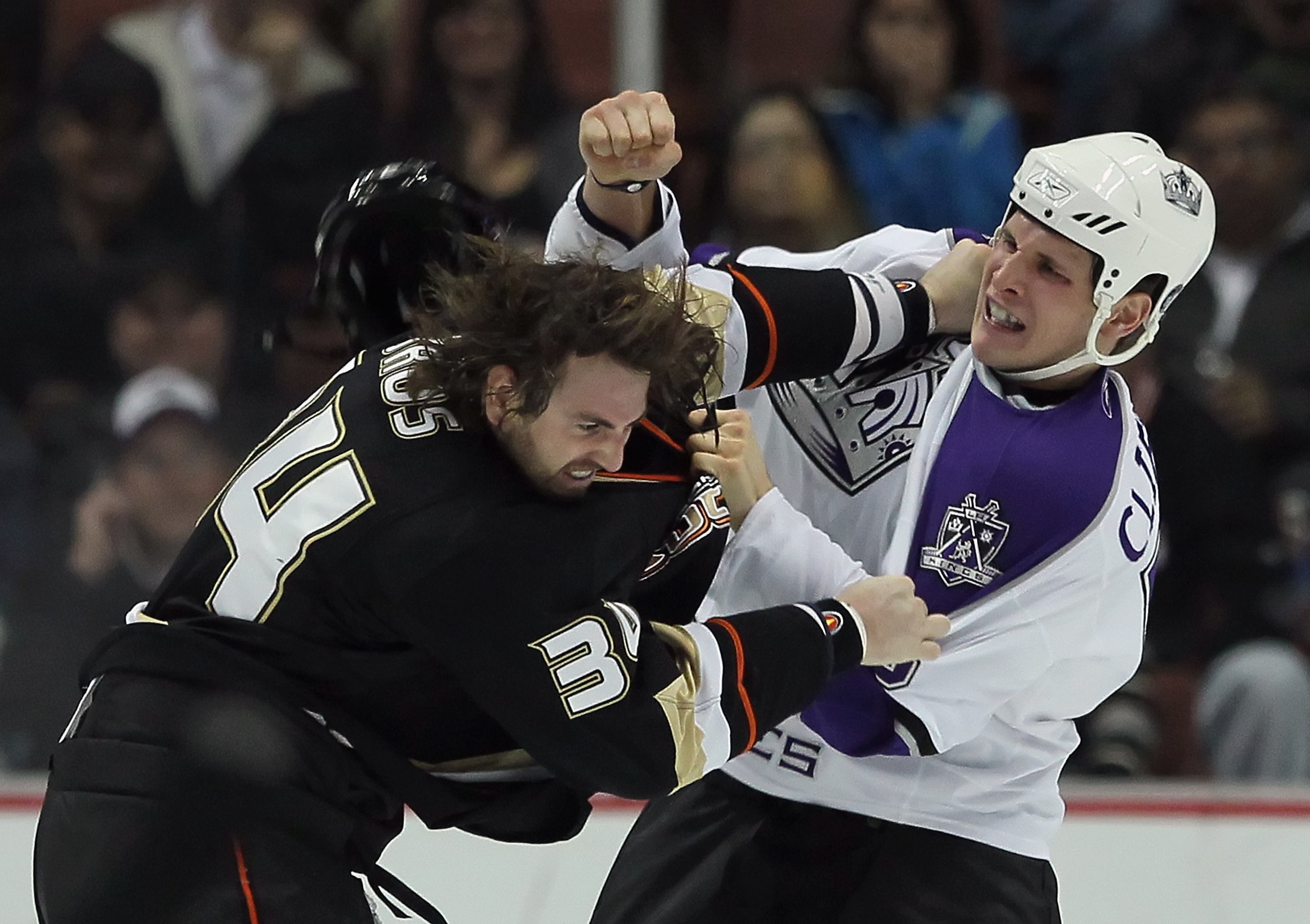 ANAHEIM, CA - NOVEMBER 29: Kyle Clifford (R) #13 of the Los Angeles Kings throws a punch at Aaron Voros #34 of the Anaheim Ducks during the first period at the Honda Center on November 29, 2010 in Anaheim, California. (Photo by Jeff Gross/Getty Images) ANAHEIM, CA - NOVEMBER 29: Kyle Clifford (R) #13 of the Los Angeles Kings throws a punch at Aaron Voros #34 of the Anaheim Ducks during the first period at the Honda Center on November 29, 2010 in Anaheim, California. (Photo by Jeff Gross/Getty Images)